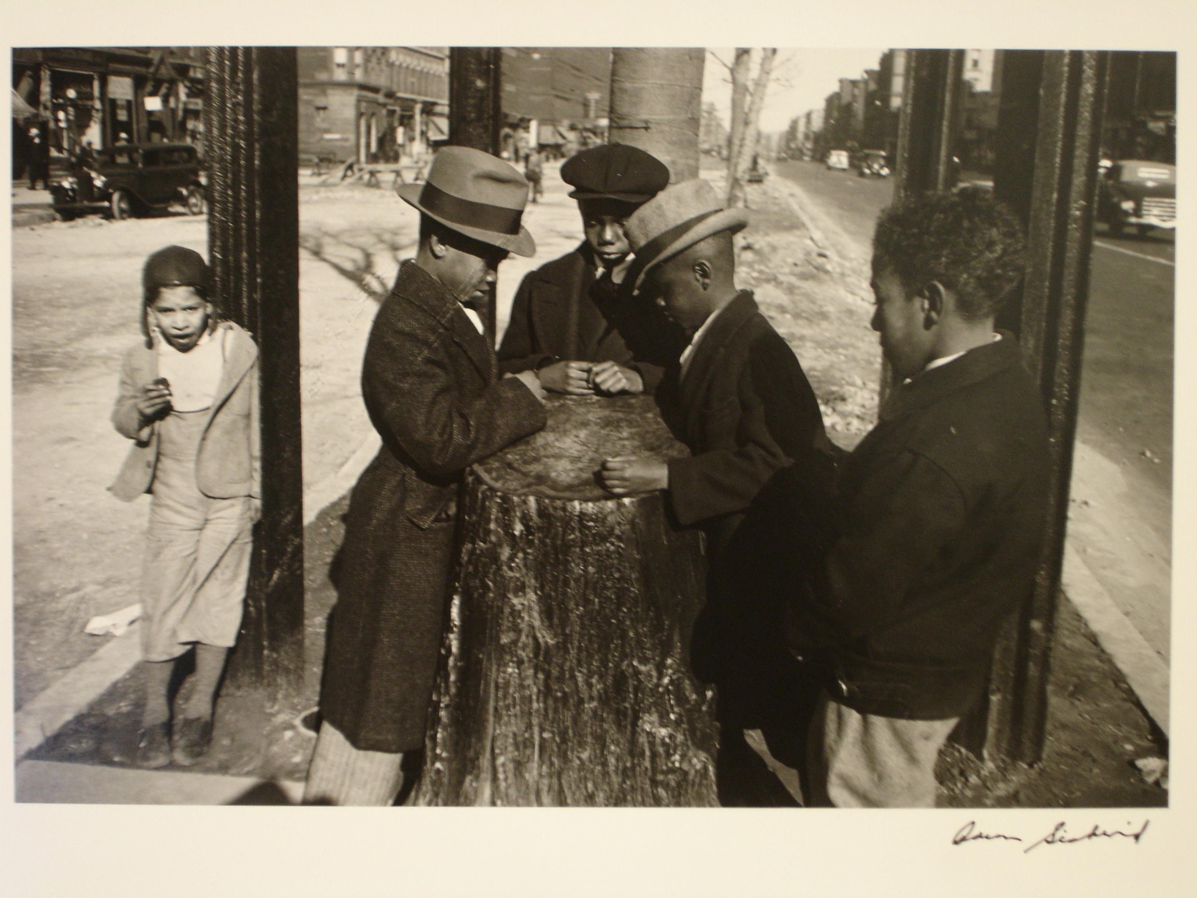 Print showing children playing around a tree stump