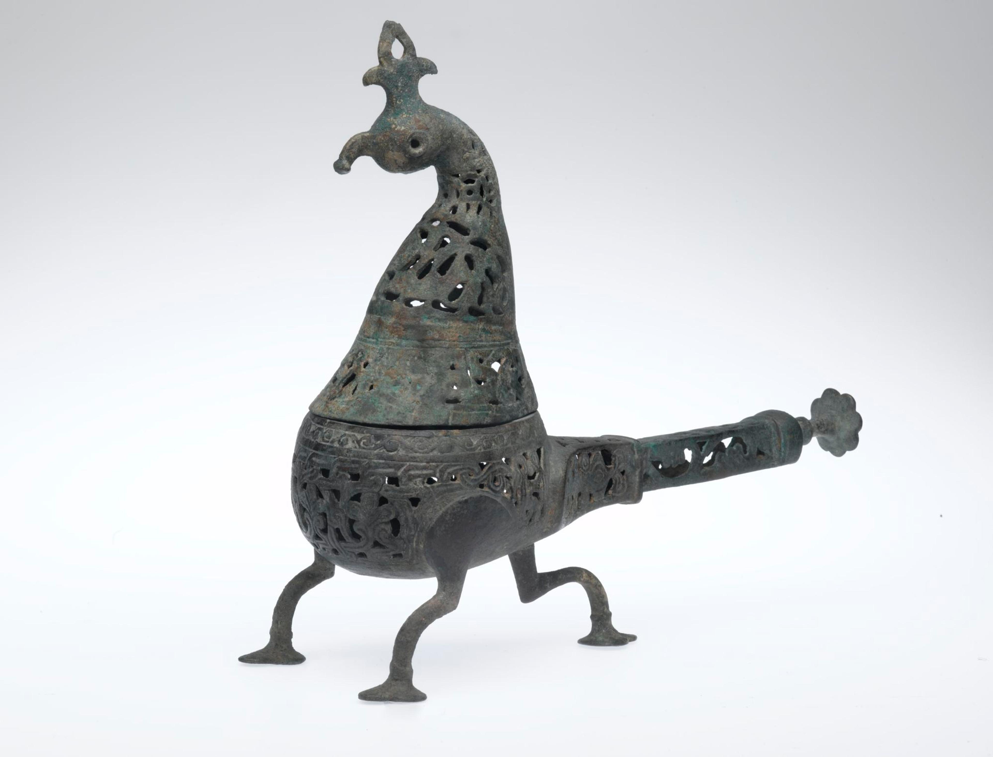 Peacock-Shape Incense Burner, Iran, Seljuk period, 12th–13th century. Copper alloy; pierced and engraved, 10 1/2 × 11 1/2 in. (26.7 × 29.2 cm). Brooklyn Museum, Special Middle Eastern Art Fund, 70.98.1. (Photo: Brooklyn Museum)