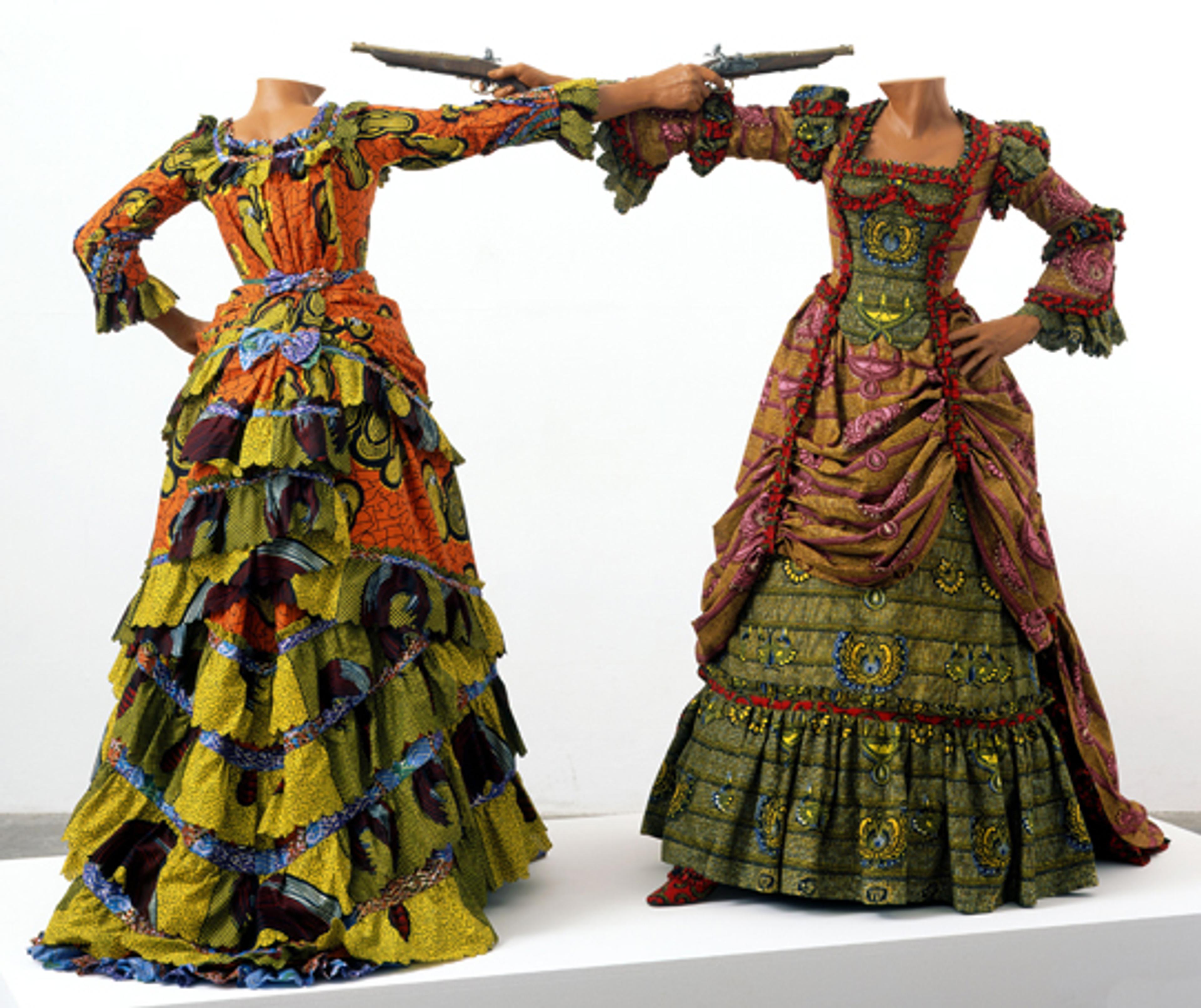 Yinka Shonibare MBE (b. United Kingdom, 1962). How to Blow Up Two Heads at Once (Ladies), 2006. Two life-size fiberglass mannequins, two guns, Dutch wax printed cotton, shoes, leather riding boots, plinth 63 × 961⁄2 x 48 in.; each figure 63 × 61 × 48 in. Davis Museum and Cultural Center, Wellesley College, Wellesley, Massachusetts, Museum purchase, Wellesley College Friends of Art. Image courtesy of the artist, Stephen Friedman Gallery, London, and James Cohan Gallery, New York. © the artist. Photo: Stephen White