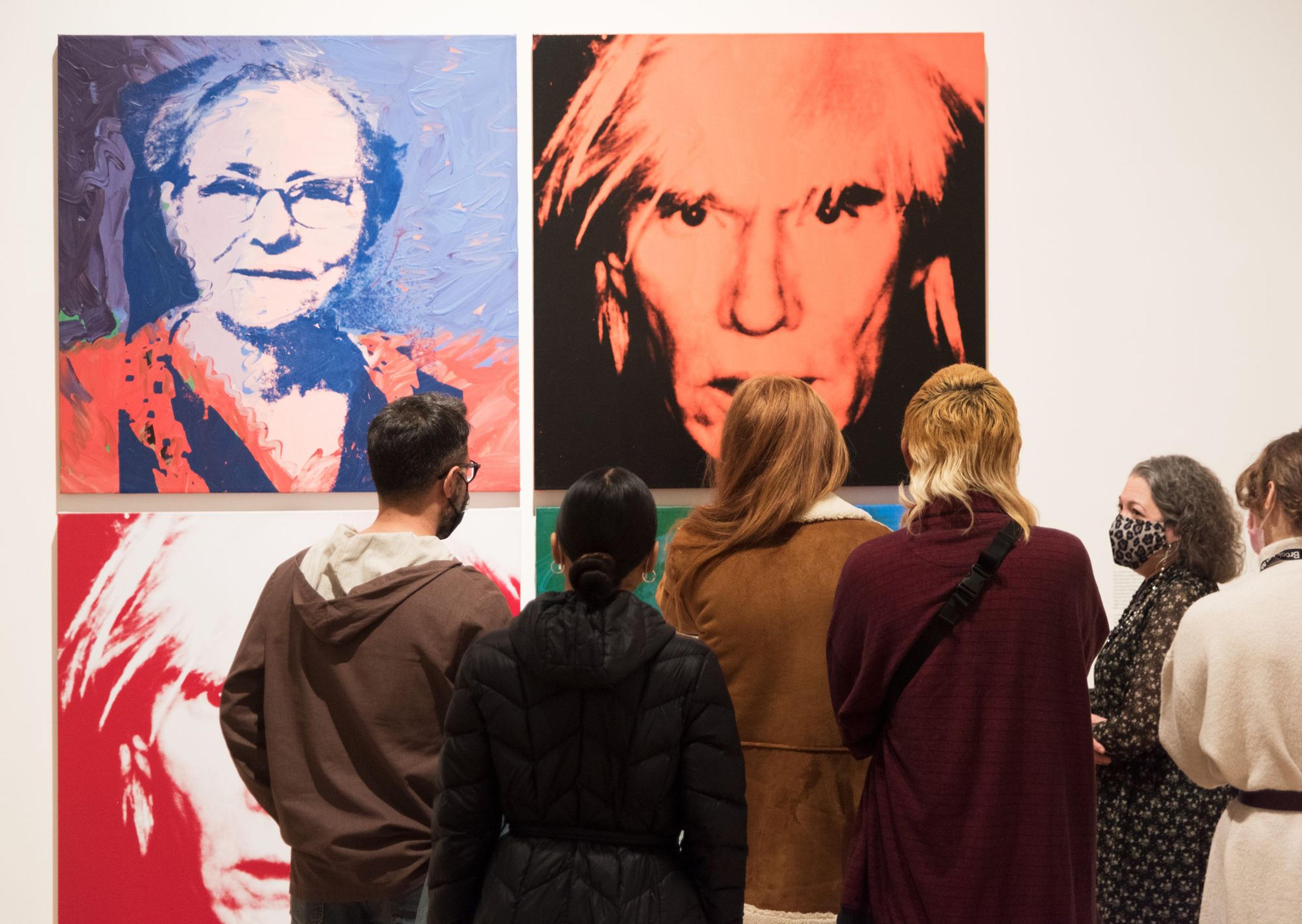 Visitors at Andy Warhol: Revelation, Brooklyn Museum, November 19, 2021–June 19, 2022. Artworks by Andy Warhol, © 2021 The Andy Warhol Foundation for the Visual Arts, Inc. Licensed by Artists Rights Society (ARS), New York. Used with permission of The Andy Warhol Foundation. (Photo: Jonathan Dorado, Brooklyn Museum)