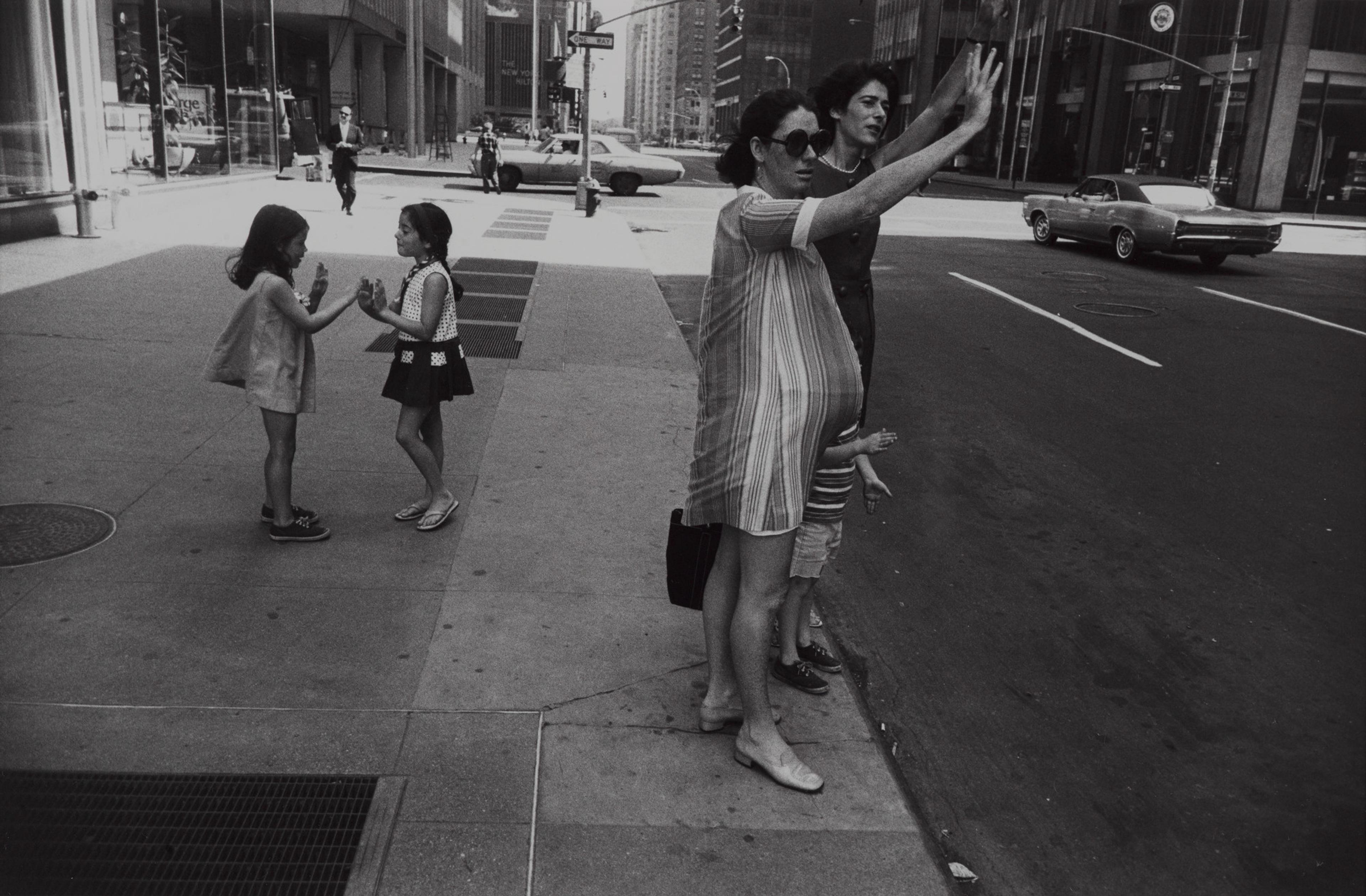 Print showing two girls playing and two women hailing a cab