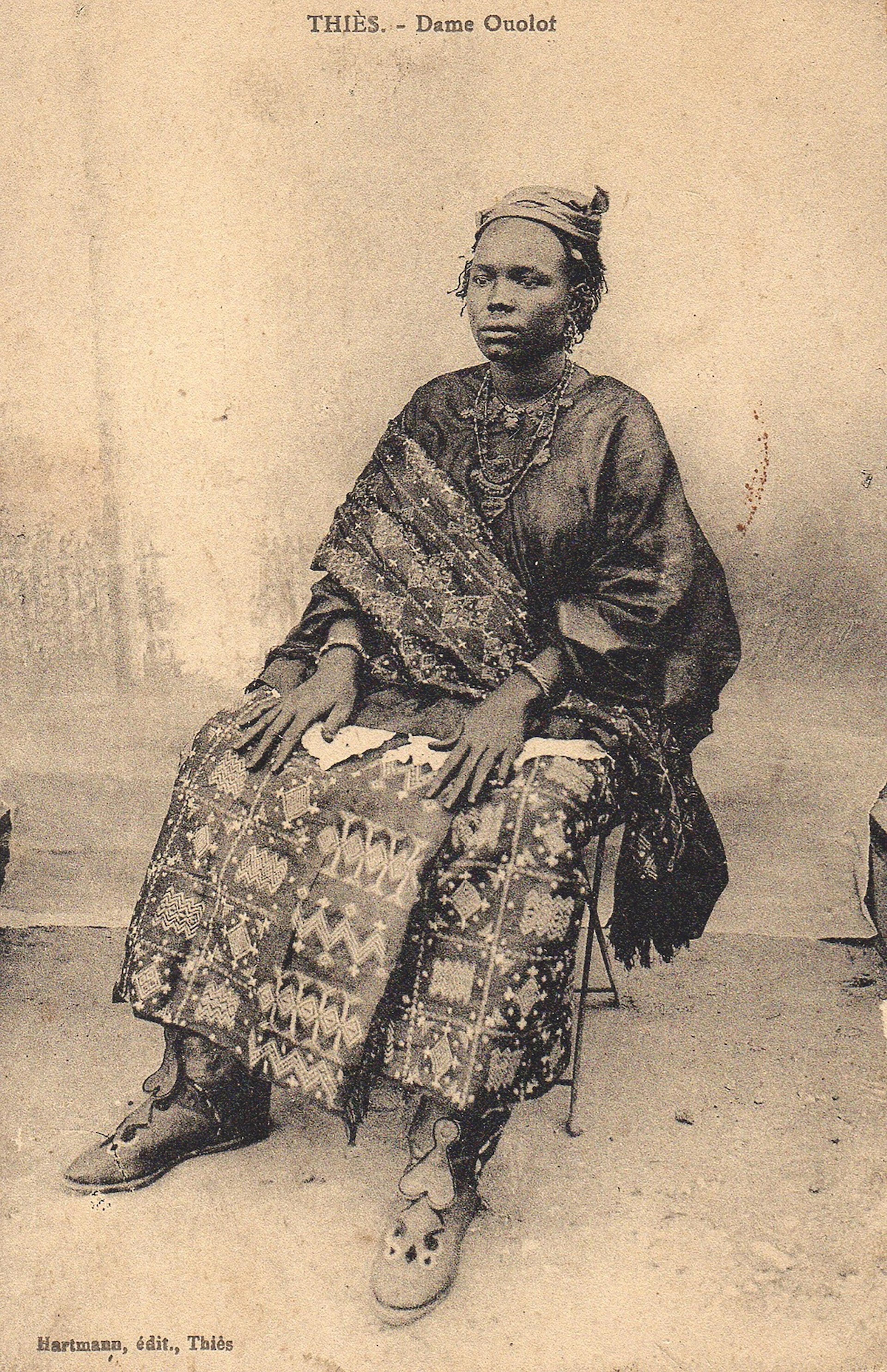 Postcard of a Wolof noblewoman in Thies, Senegal wearing an indigo prestige cloth, circa 1910, Editions Hartmann. Photo courtesy of The McKinley Collection.