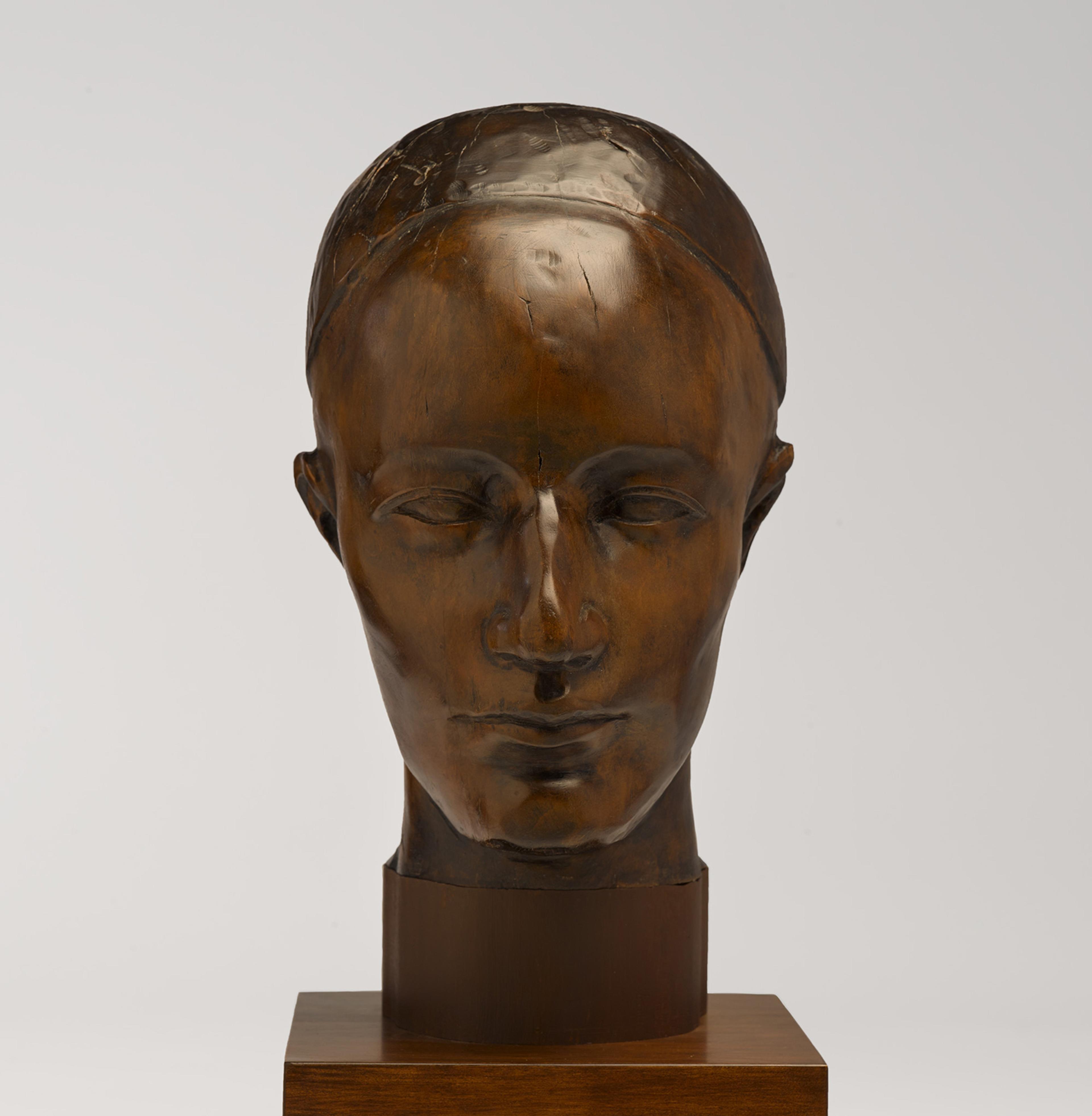 A wooden head sculpture