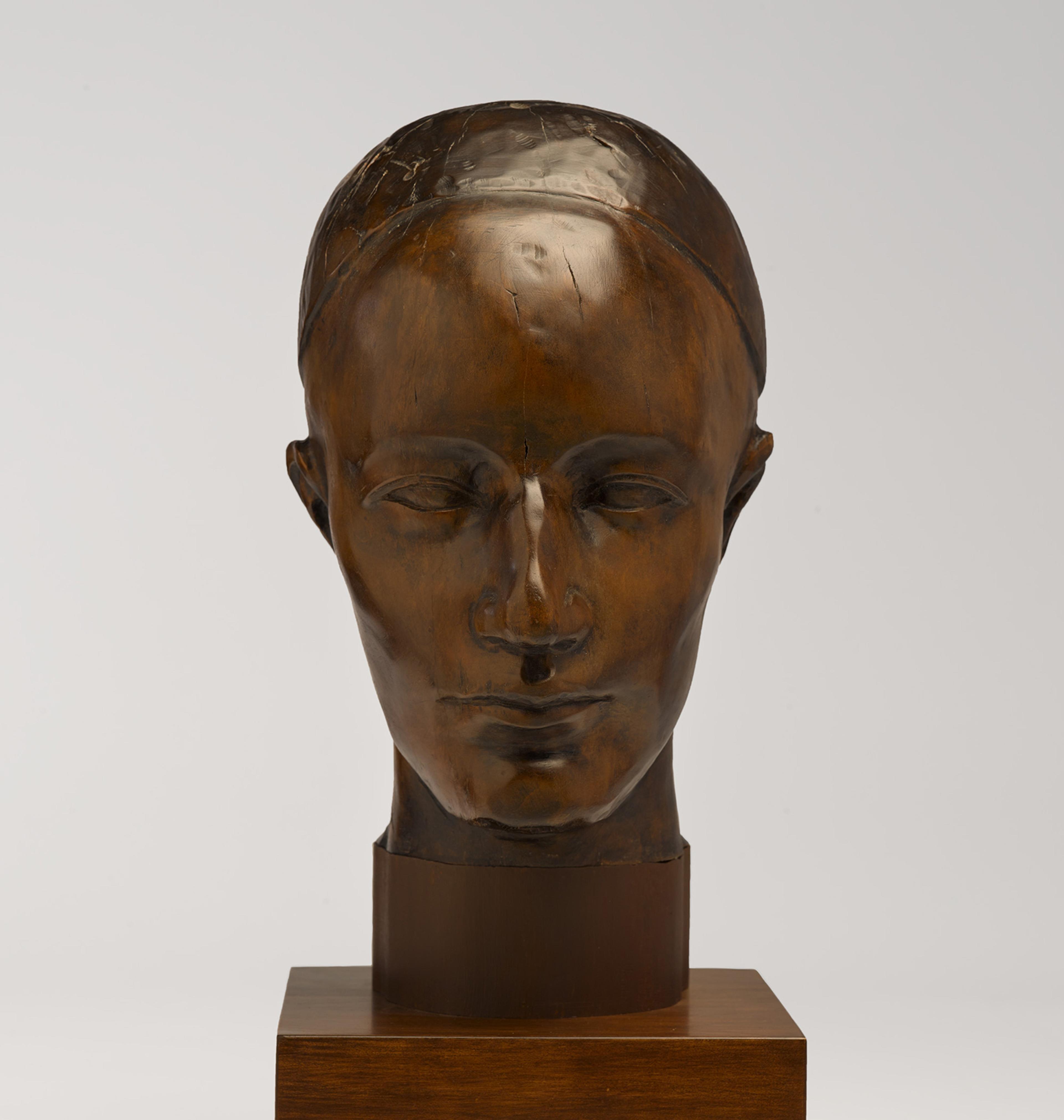 A wooden head sculpture