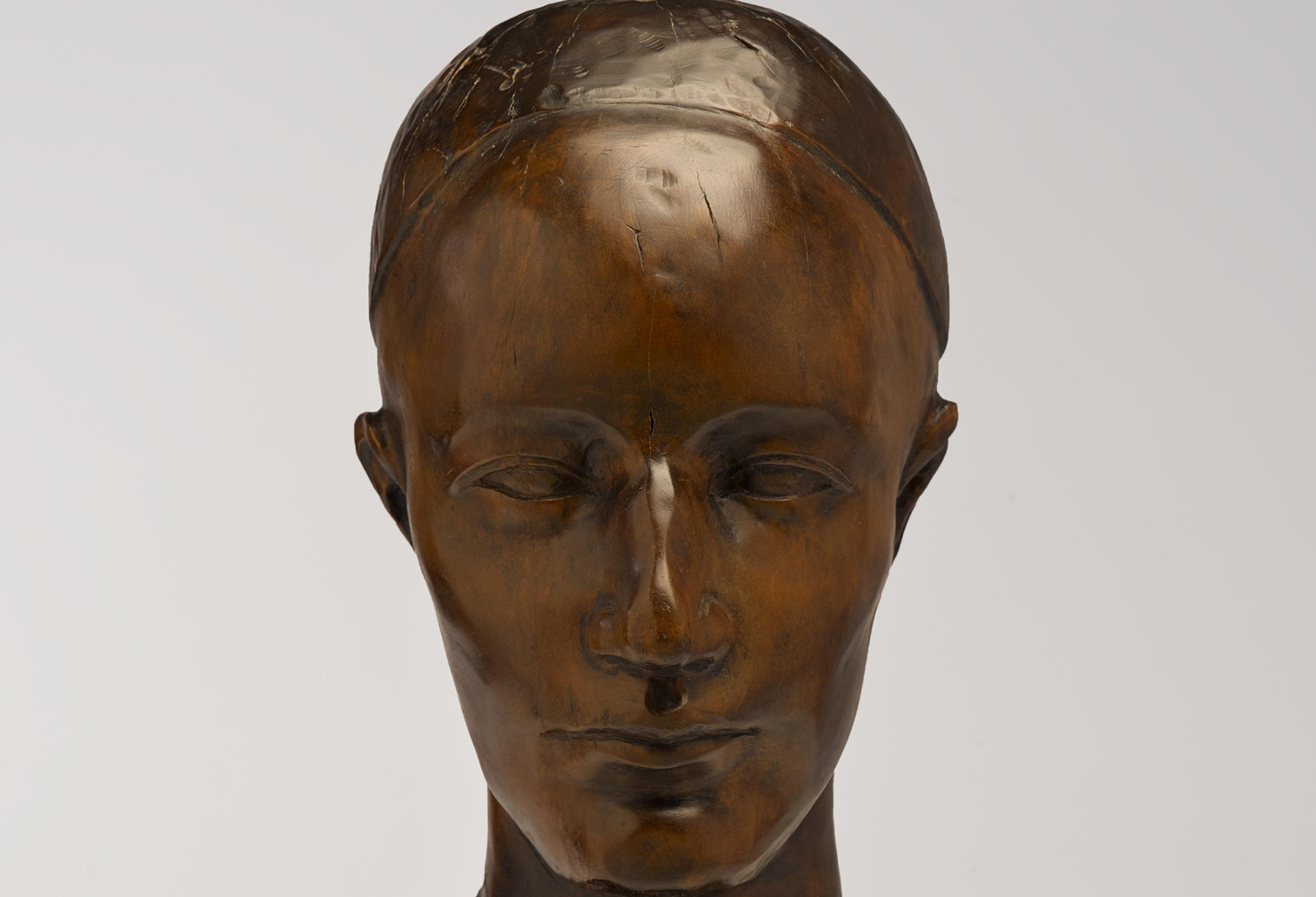 A wooden head sculpture