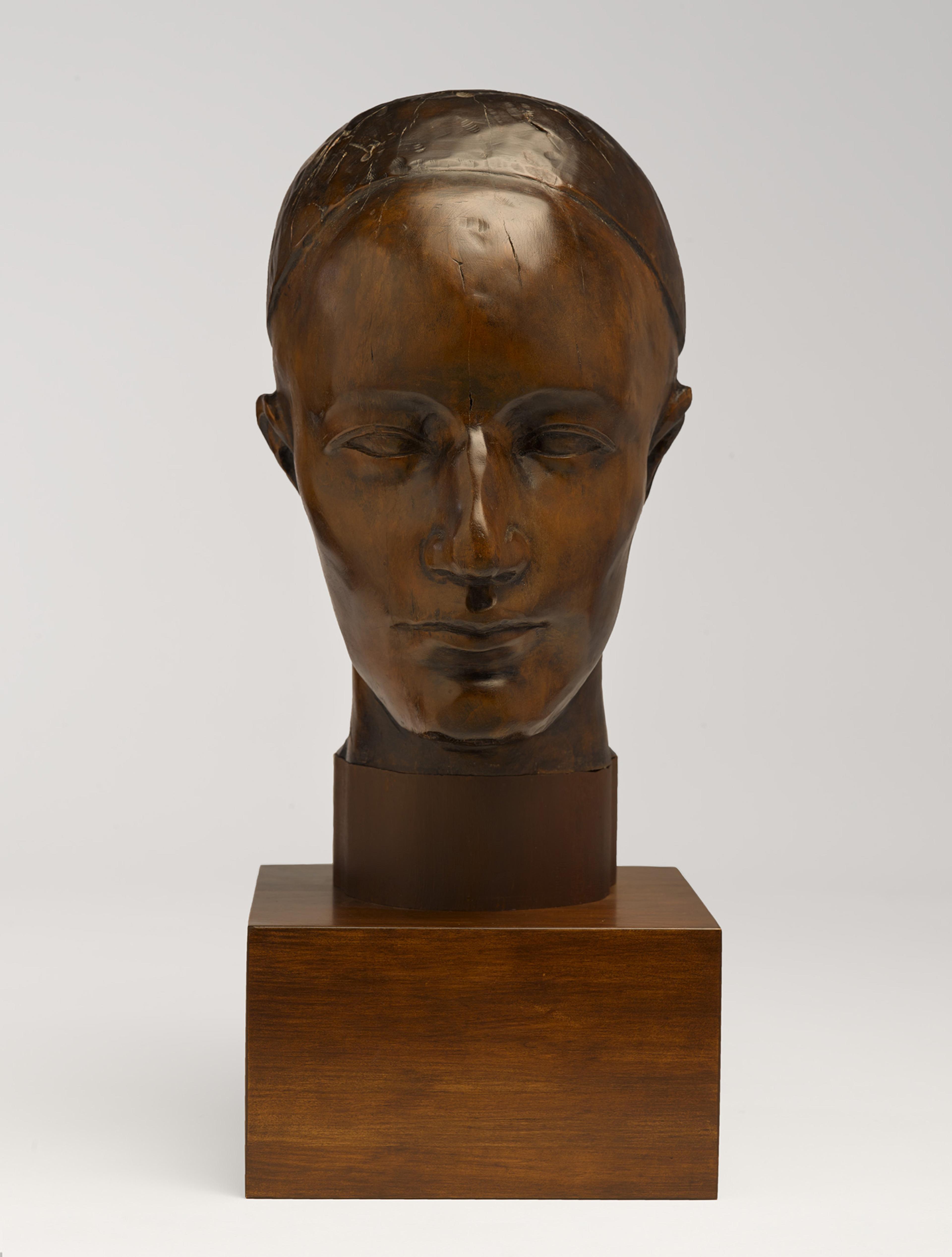 A wooden head sculpture