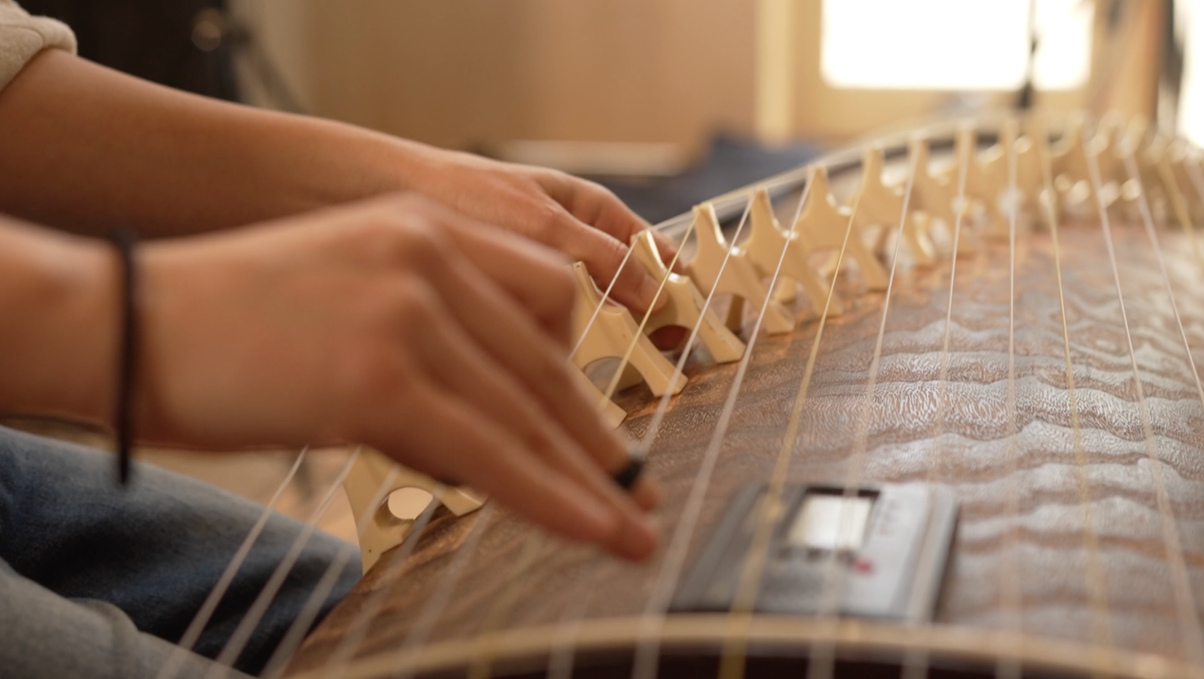 Yumi Kurosawa plays the koto at a recording session on March 13, 2024. (Photo: Kenneth Sousie)