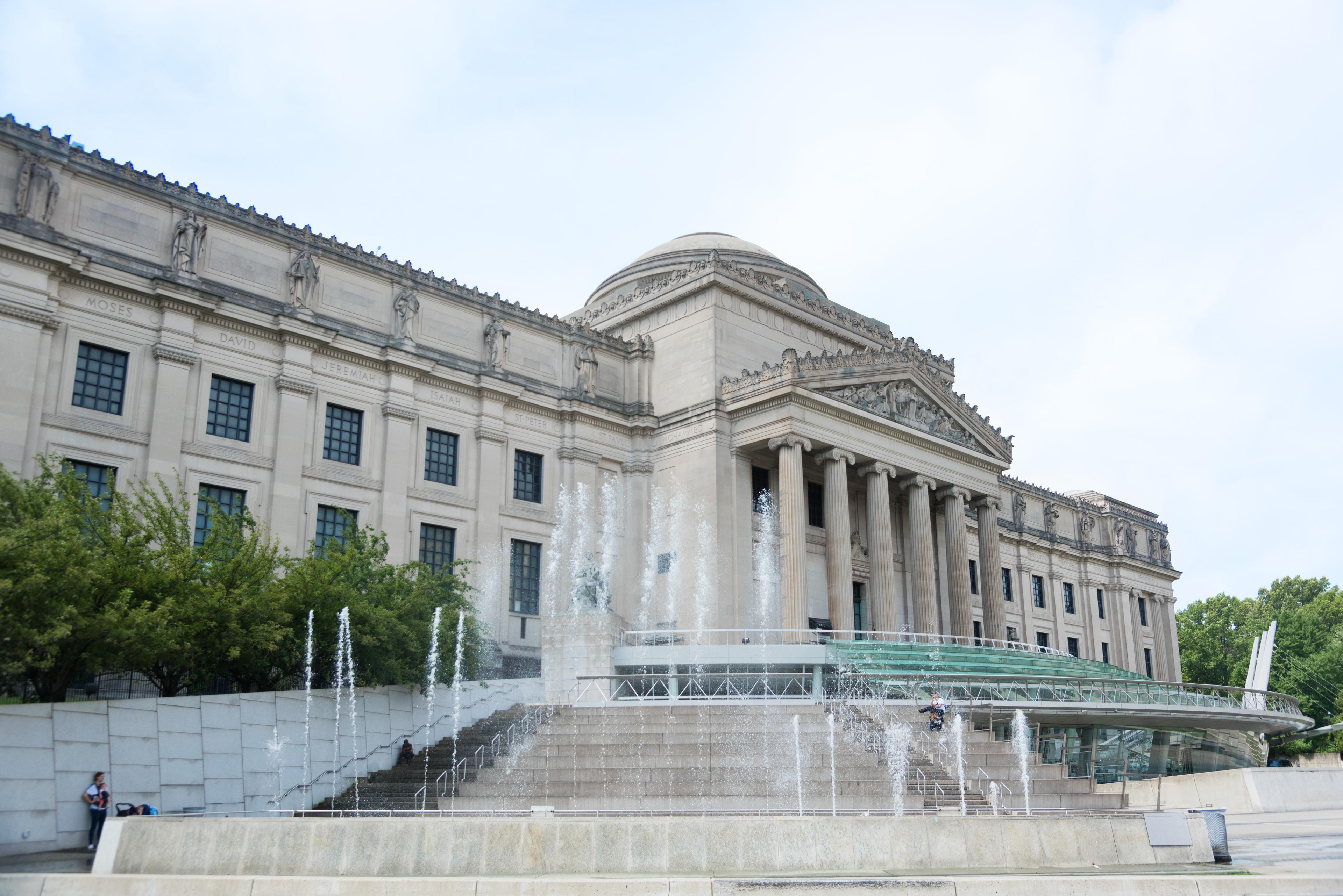 View of the Brooklyn Museum with the plaza steps and fountains on