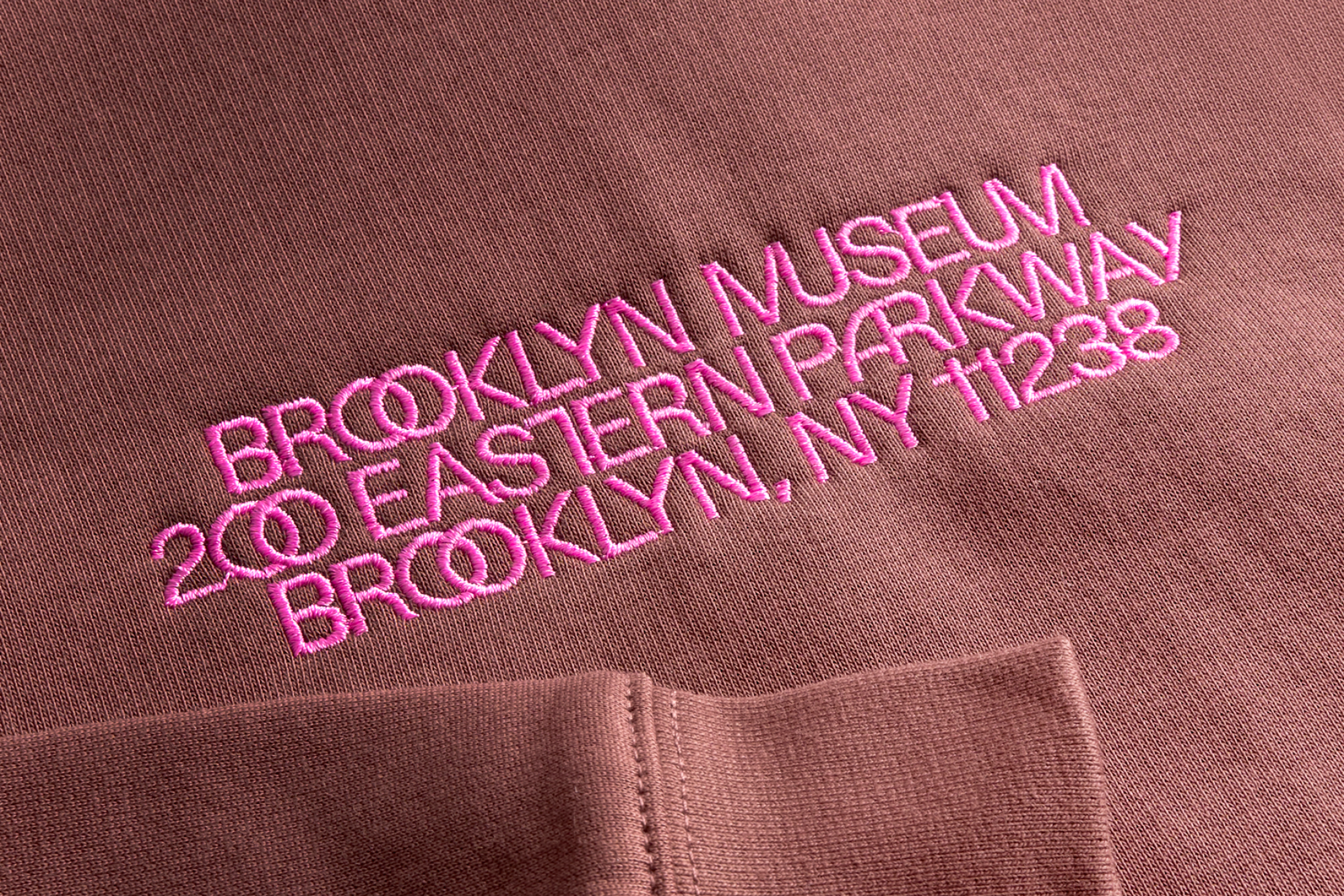 Detail of a Brooklyn Museum hoodie with the name and address