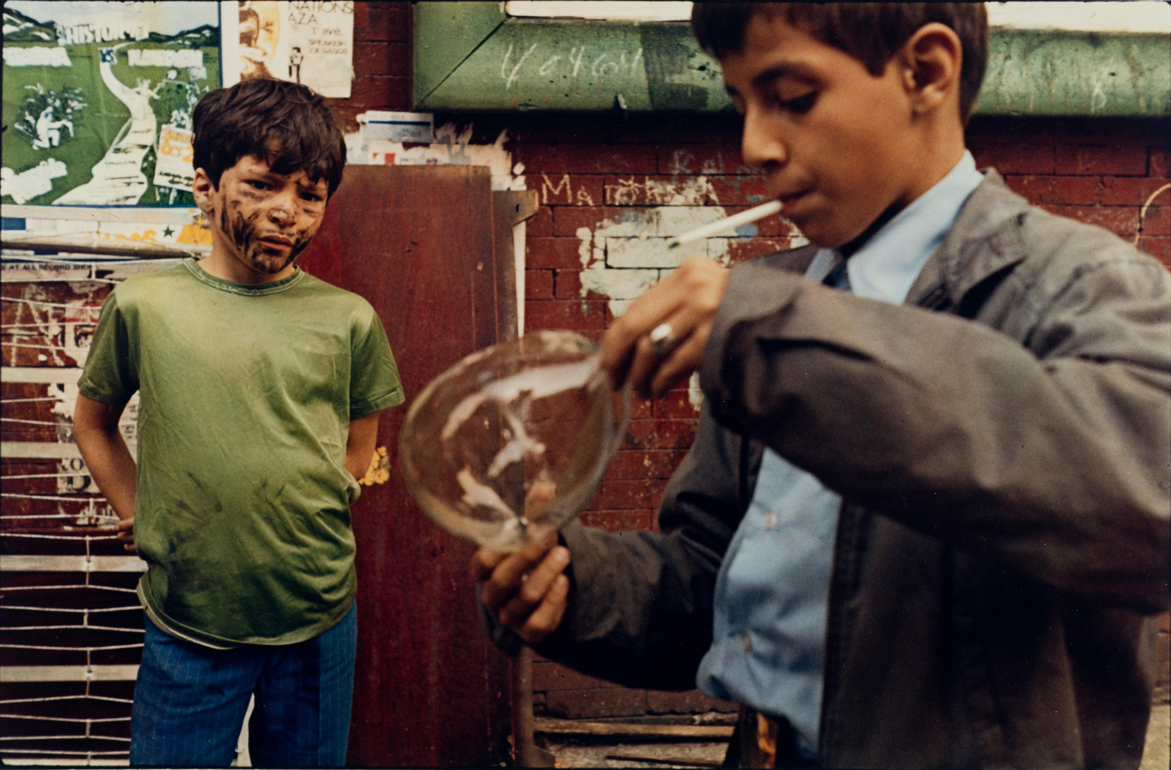 Print showing two boys, one smoking a cigarette and holding a bubble