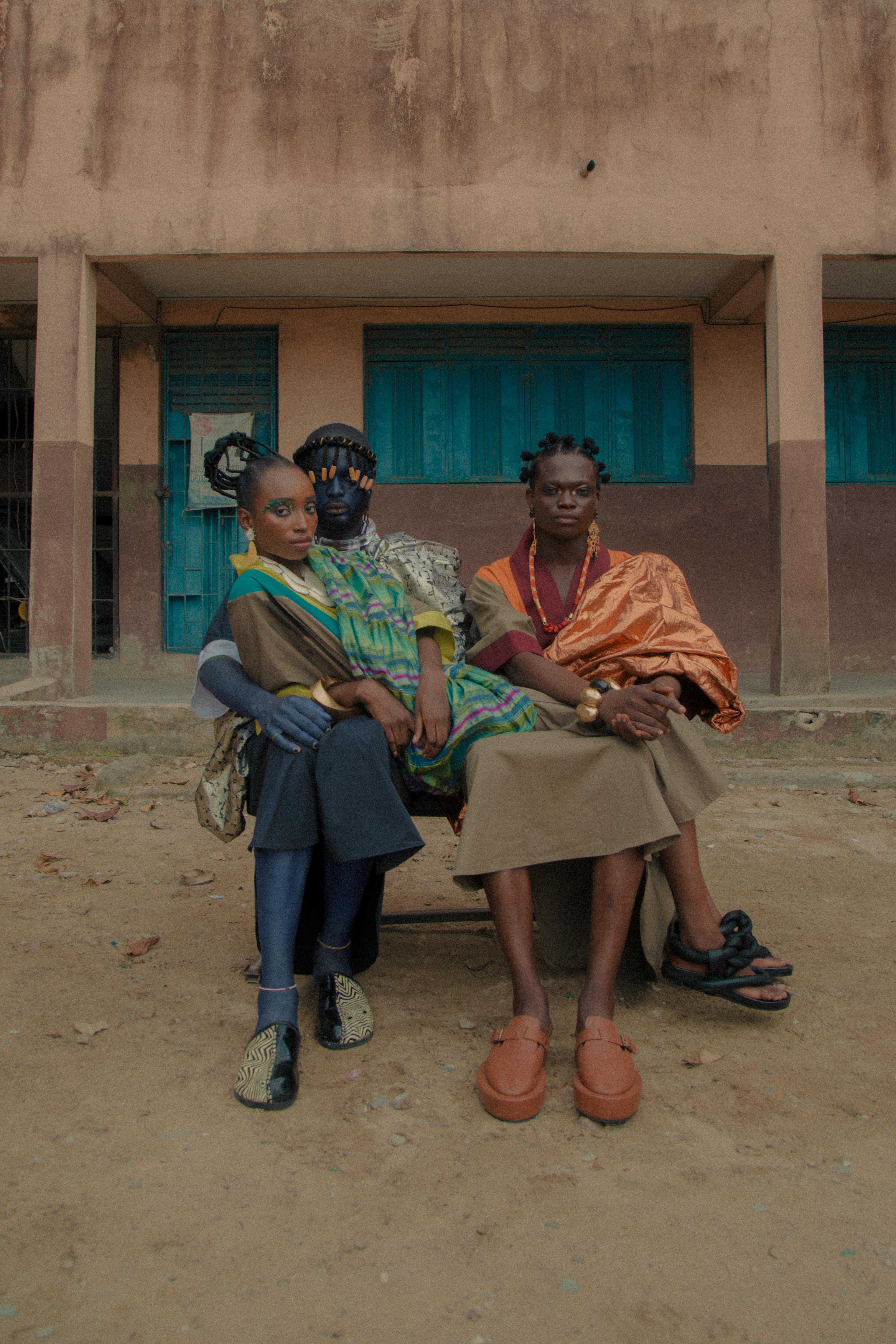 Left to right: Francis wears Turfah robe and scarf from Alara, Monies earrings and choker from Alara, own shoes. Ewaoluwa wears Turfah robe and scarf from Alara, Peet Dullaert earrings from Alara, Monies necklace and bangle from Alara, Pichulik necklace from Alara, George Lamondelli bangle from Alara, Zanger shoes. Ayorinde wears Turfah robe and scarf from Alara, Mercedes Salazar earrings from Alara, Monies bracelet from Alara, Kkerele shoes. Photography by Ruby Okoro (full credit below).