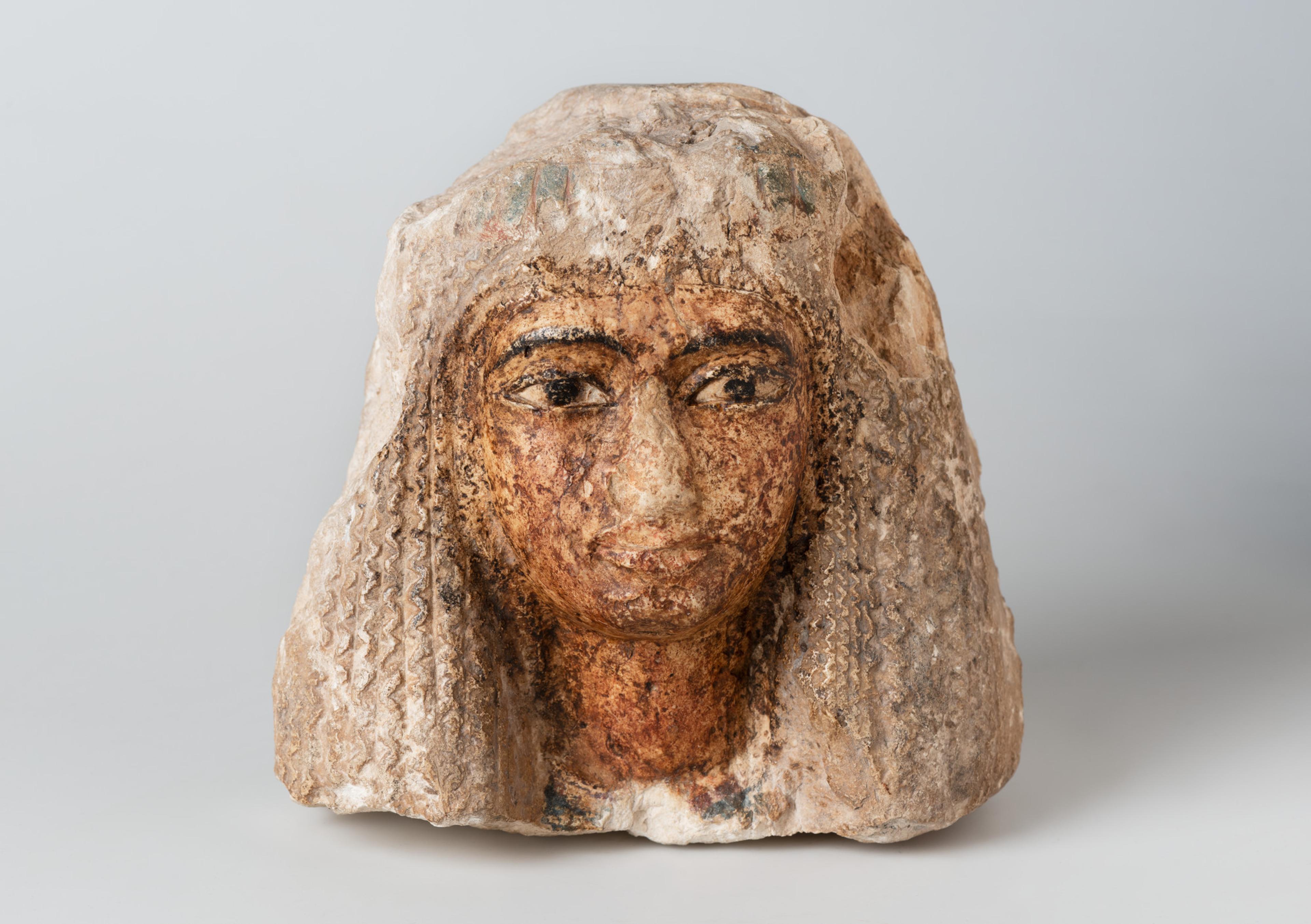 Head of a Woman Wearing an Elaborate Wig, ca. 1352–1190 B.C.E. Limestone, pigment. Brooklyn Museum; Charles Edwin Wilbour Fund, 37.256E. (Photo: Brooklyn Museum)