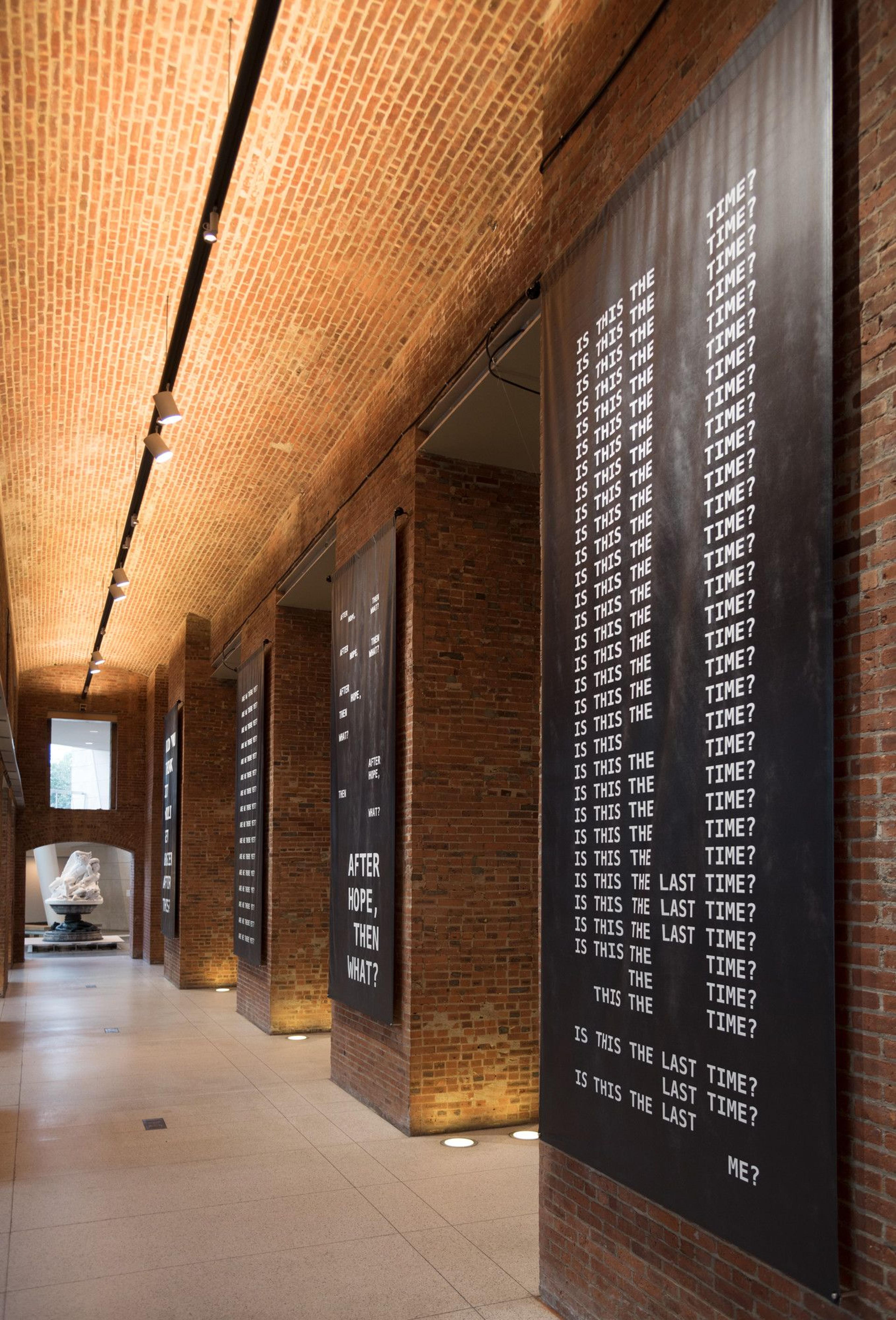 Kameelah Janan Rasheed (American, born 1985). Installation view, A QUESTION IS A SENTENCE DESIGNED TO ELICIT A RESPONSE. TODAY, WE WANT TO KNOW WHAT THE SLOPPY FUTURE HOLDS, 2018. Textile (blackout fabric), four banners, each 170 × 72 (431.8 × 182.9 cm). Courtesy of the artist. © Kameelah Janan Rasheed. (Photo: Jonathan Dorado)