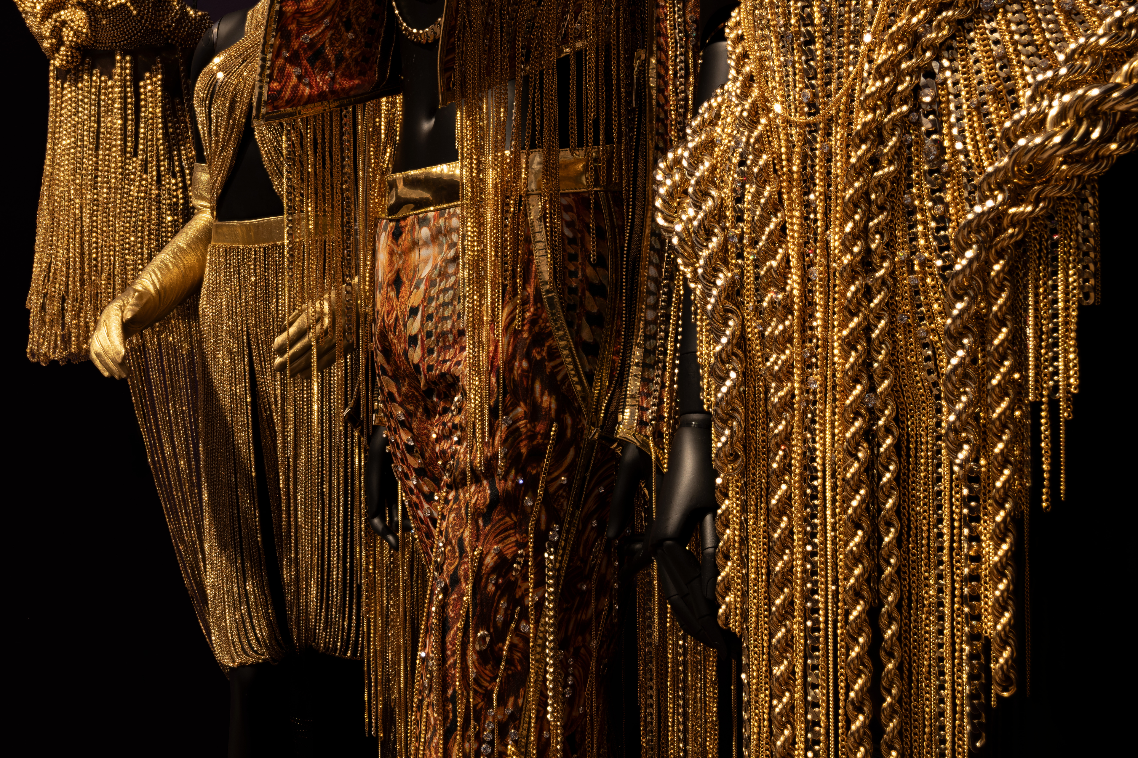 A detailed image of metallic gold fashions