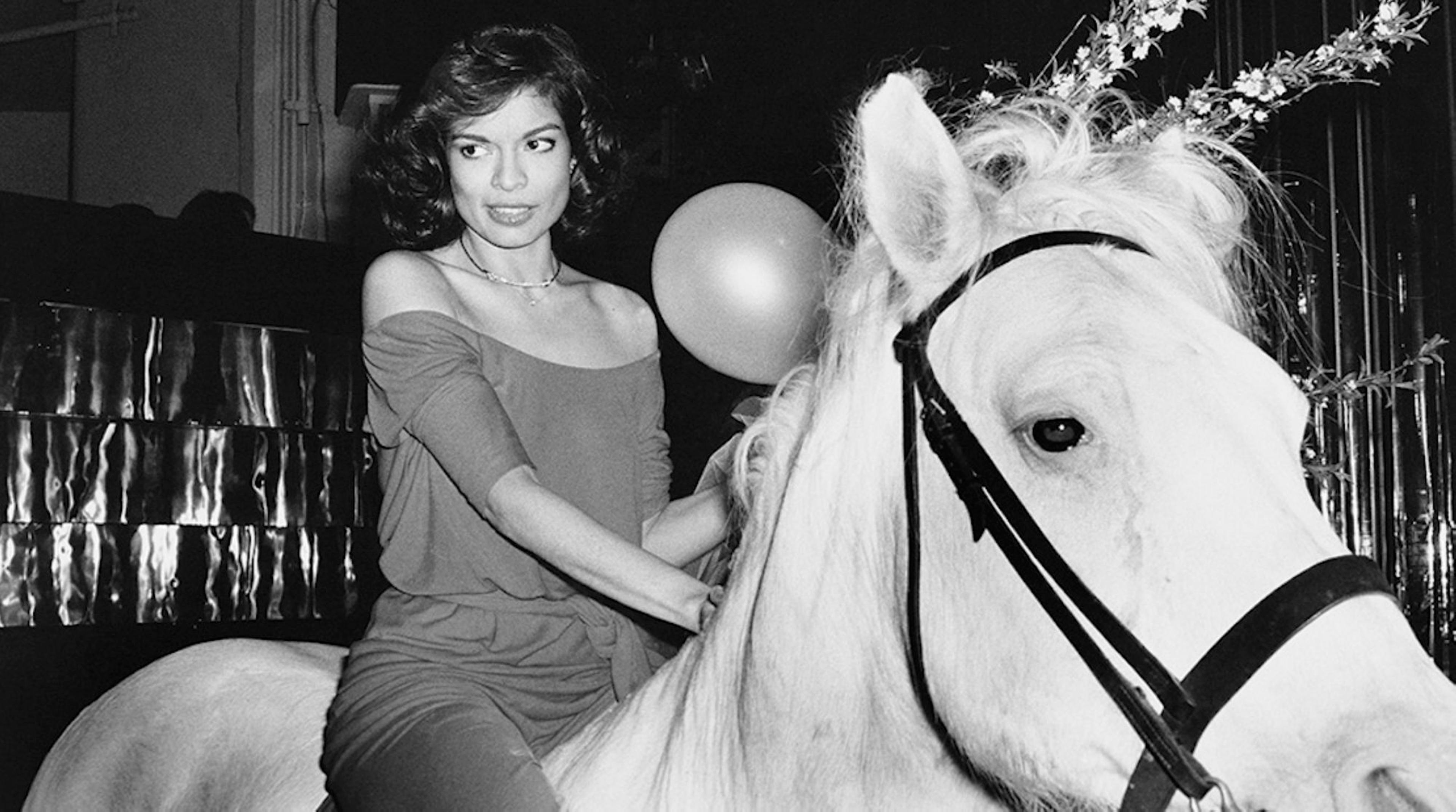 Rose Hartman (American, born 1937). Bianca Jagger Celebrating her Birthday, Studio 54, 1977. Black and white photograph. Courtesy of the artist, www.rosehartman.com. © Rose Hartman