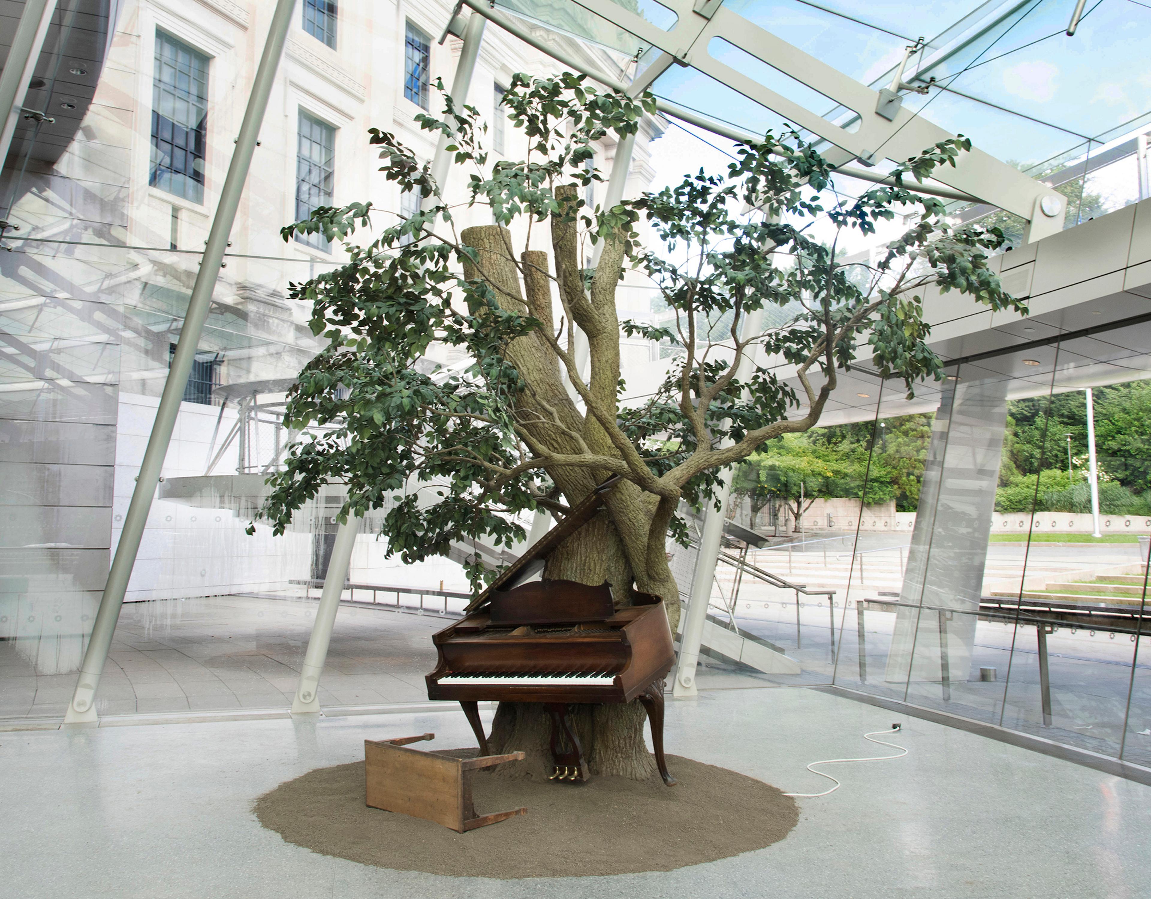 Sanford Biggers (American, born 1970). Blossom, 2007. Steel, plastic and synthetic fibers, wood, MIDI player piano system, Zoopoxy, paint, dirt, modelling clay, polyurethane foam, 12 x 18 x 15 feet (365.9 x 548.8 x 457.3 cm) overall. Brooklyn Museum; Purchase gift of Toby Devan Lewis, Charles and Amber Patton, and an anonymous donor, gift of the Contemporary Art Council, and the Mary Smith Dorward Fund, 2011.10. © Sanford Biggers (Photo: Brooklyn Museum)