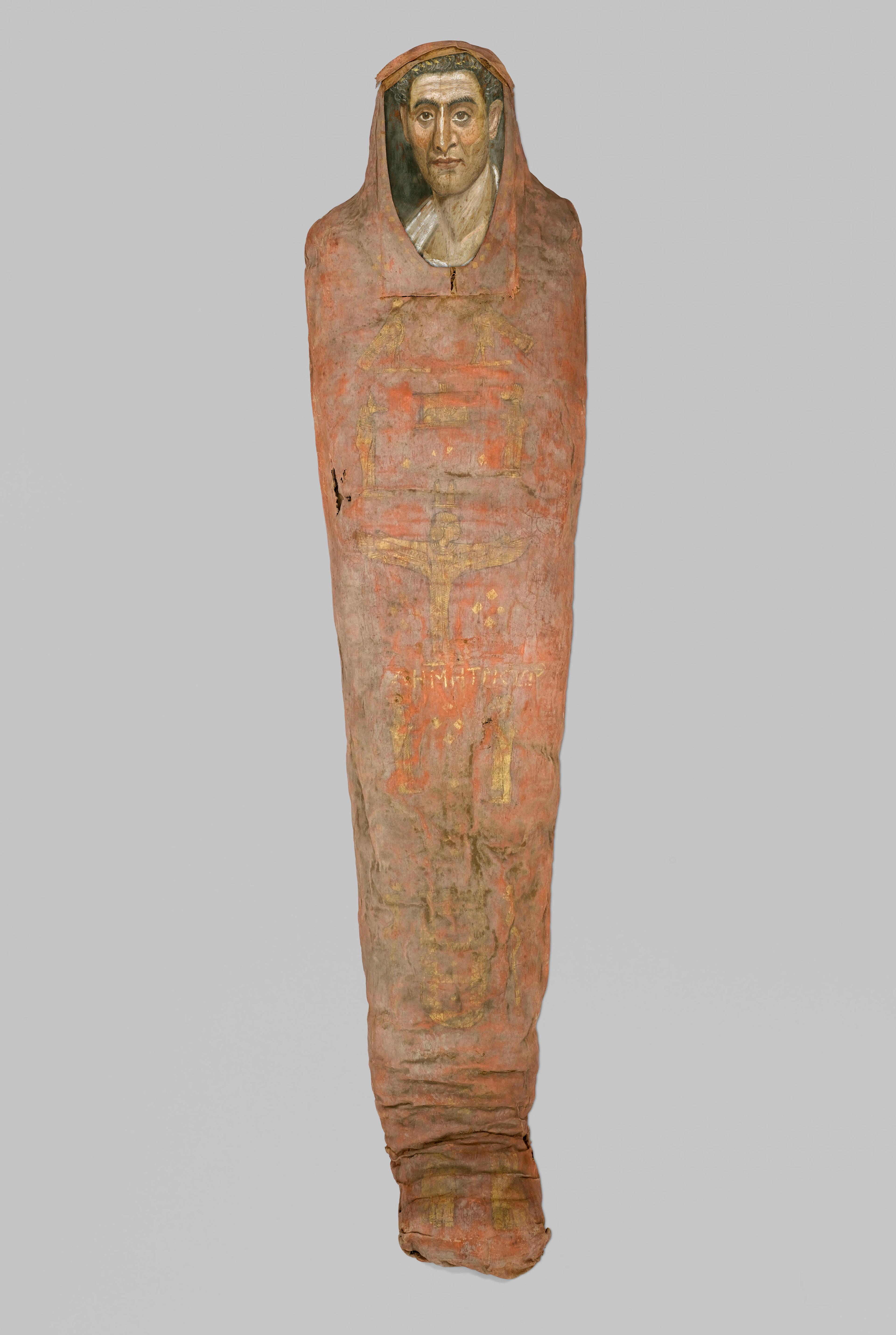 The Mummy of Demetri[o]s, 95–100 C.E. Painted cloth, gold, human remains, wood, encaustic, gilding, 133⁄8 x 153⁄8 x 7413⁄16 in., 130 lb. (34 x 39 x 190 cm, 58.97kg). Brooklyn Museum, Charles Edwin Wilbour Fund, 11.600