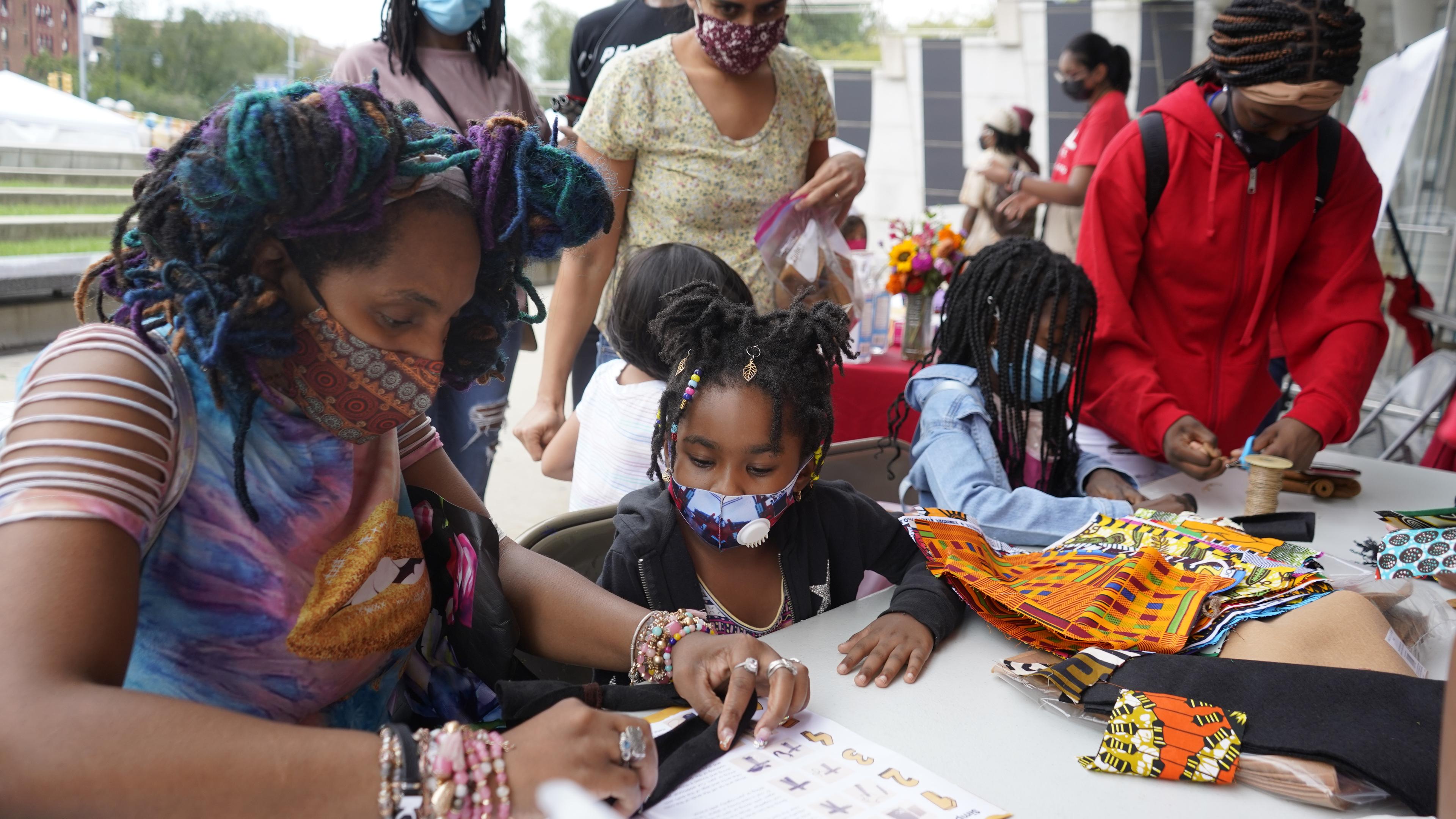 Families create art at a Bring the Cool Family Festival at the Brooklyn Museum. (Photo: Stella Magliore)