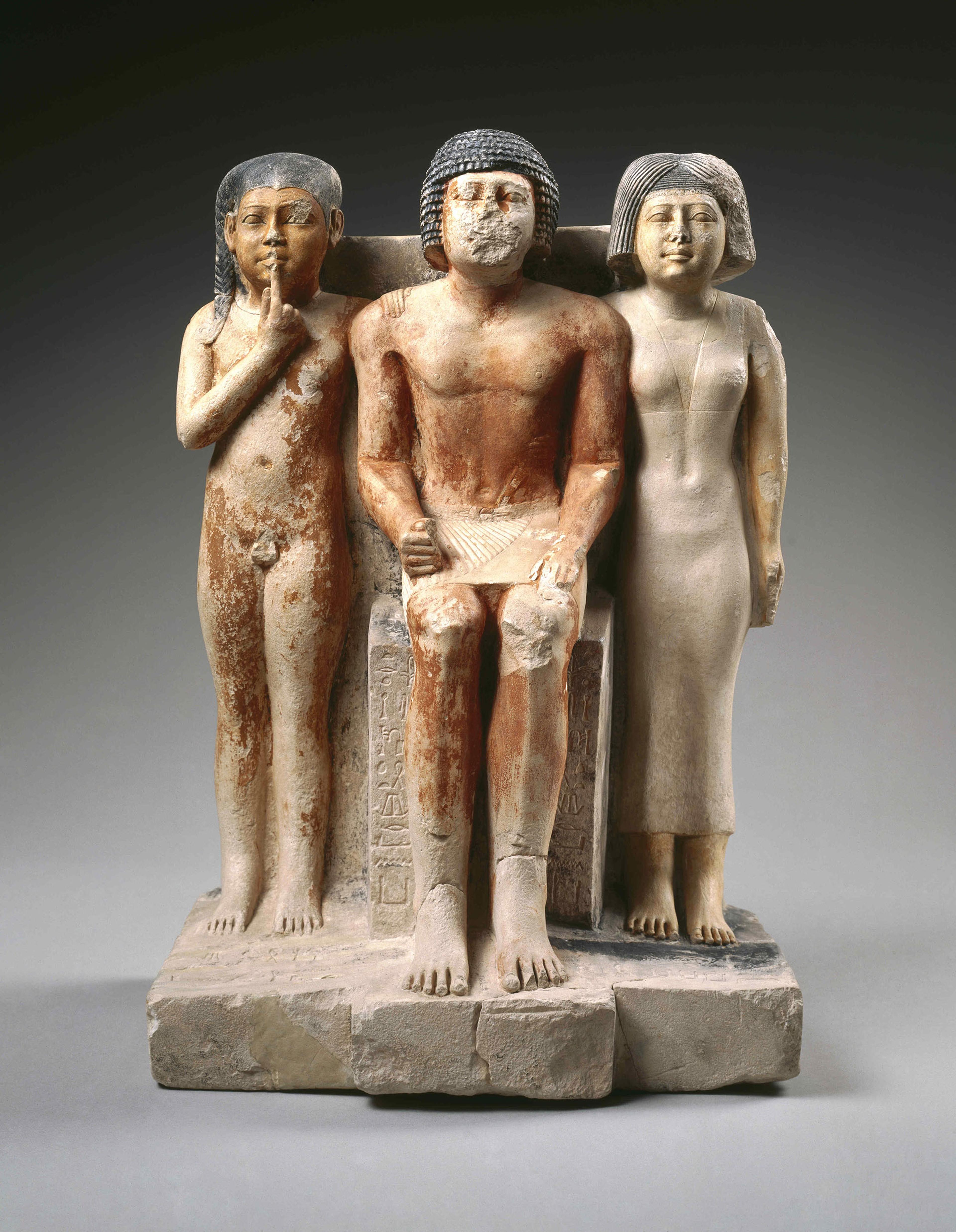 Statue of Nykara and His Family. Egypt, provenance not known. Old Kingdom, late Dynasty 5, circa 2455–2350 B.C.E. Limestone, painted, 225⁄8 x 141⁄2 x 107⁄8 in. (57.5 × 36.8 × 27.7 cm). Brooklyn Museum, Charles Edwin Wilbour Fund, 49.215