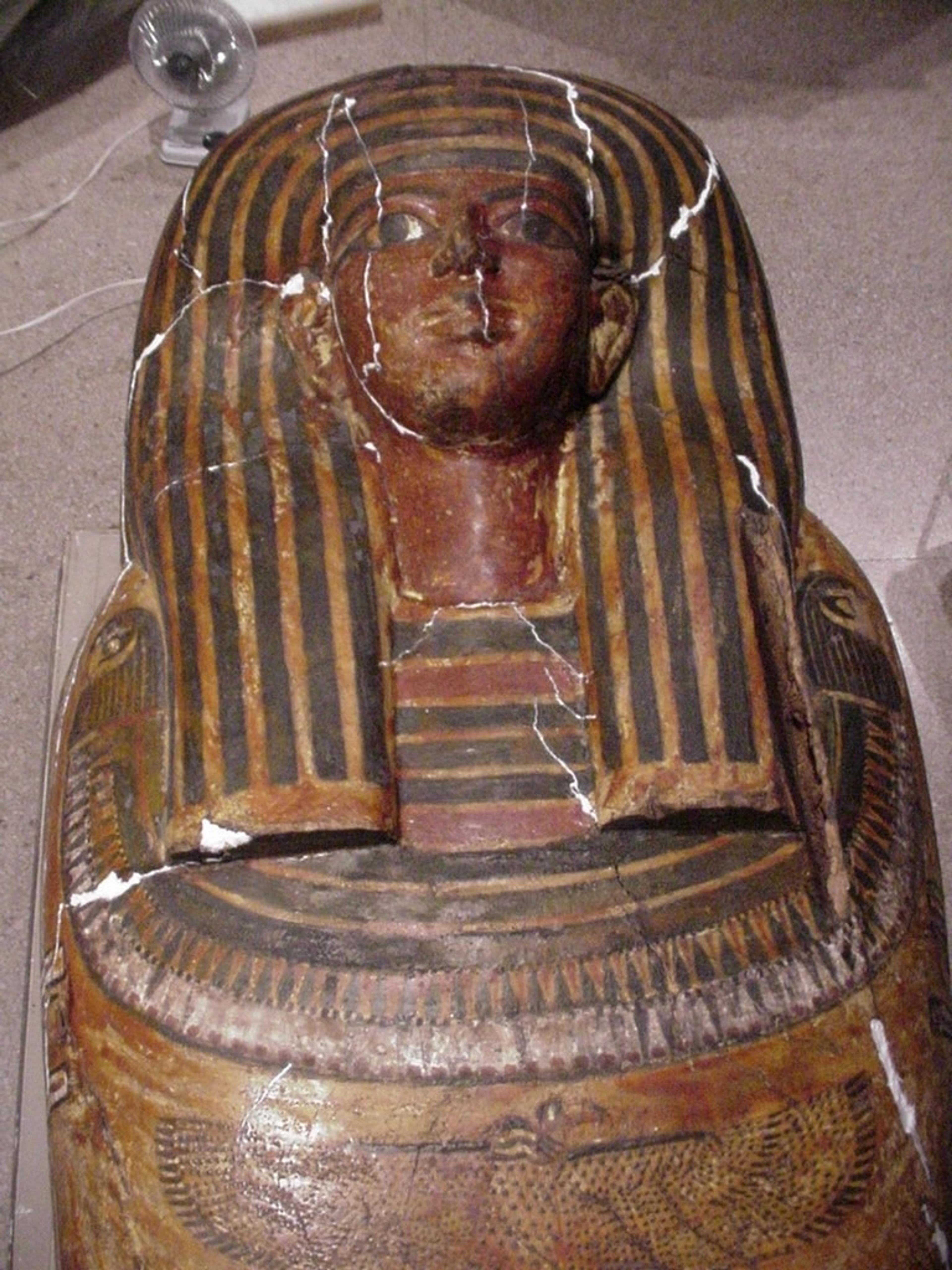 Photograph of an Egyptian coffin showing cracks