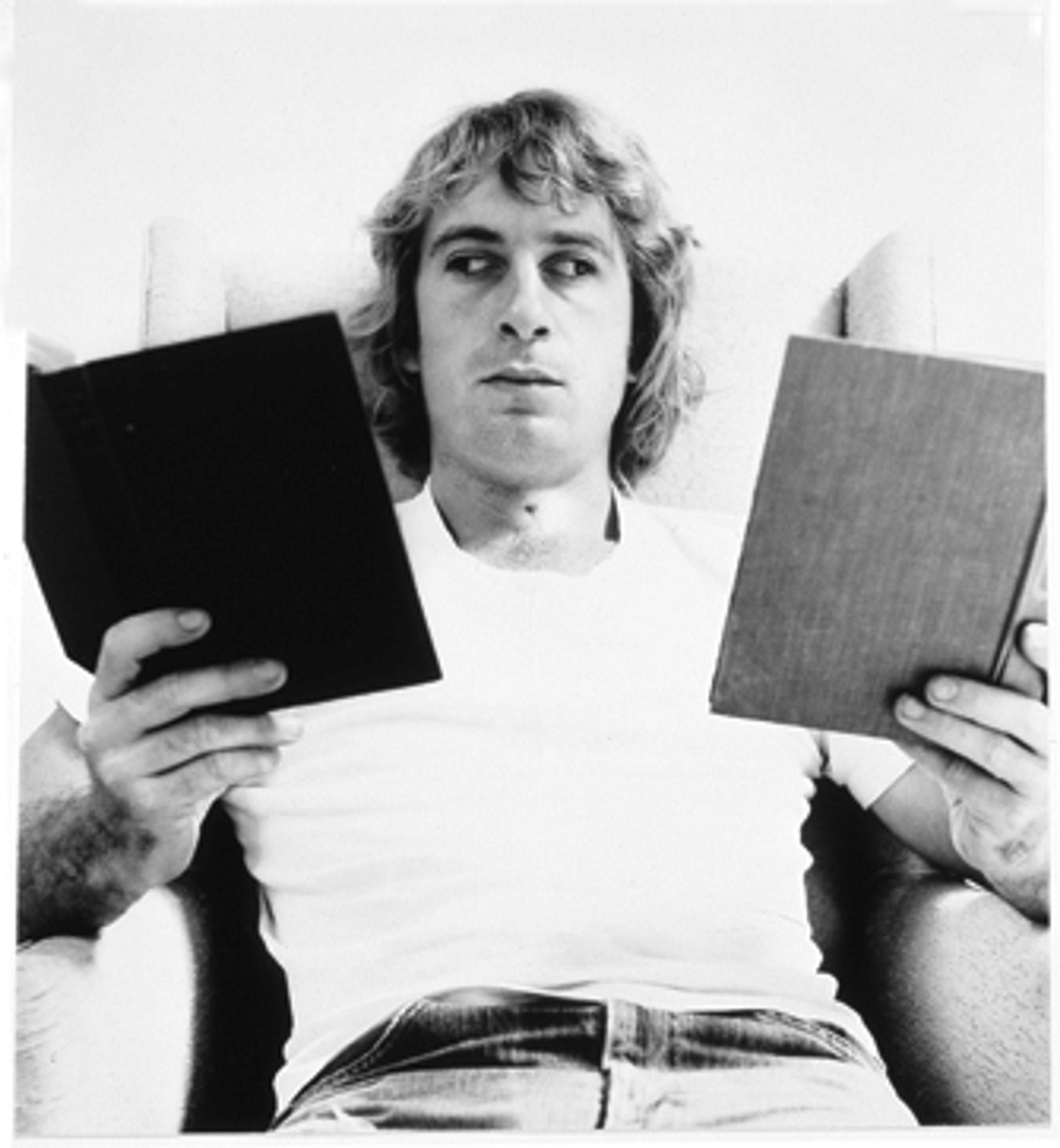 William Wegman (American, b. 1943). Reading Two Books, 1971. Gelatin silver print. Collection of Robert and Gayle Greenhill, © William Wegman