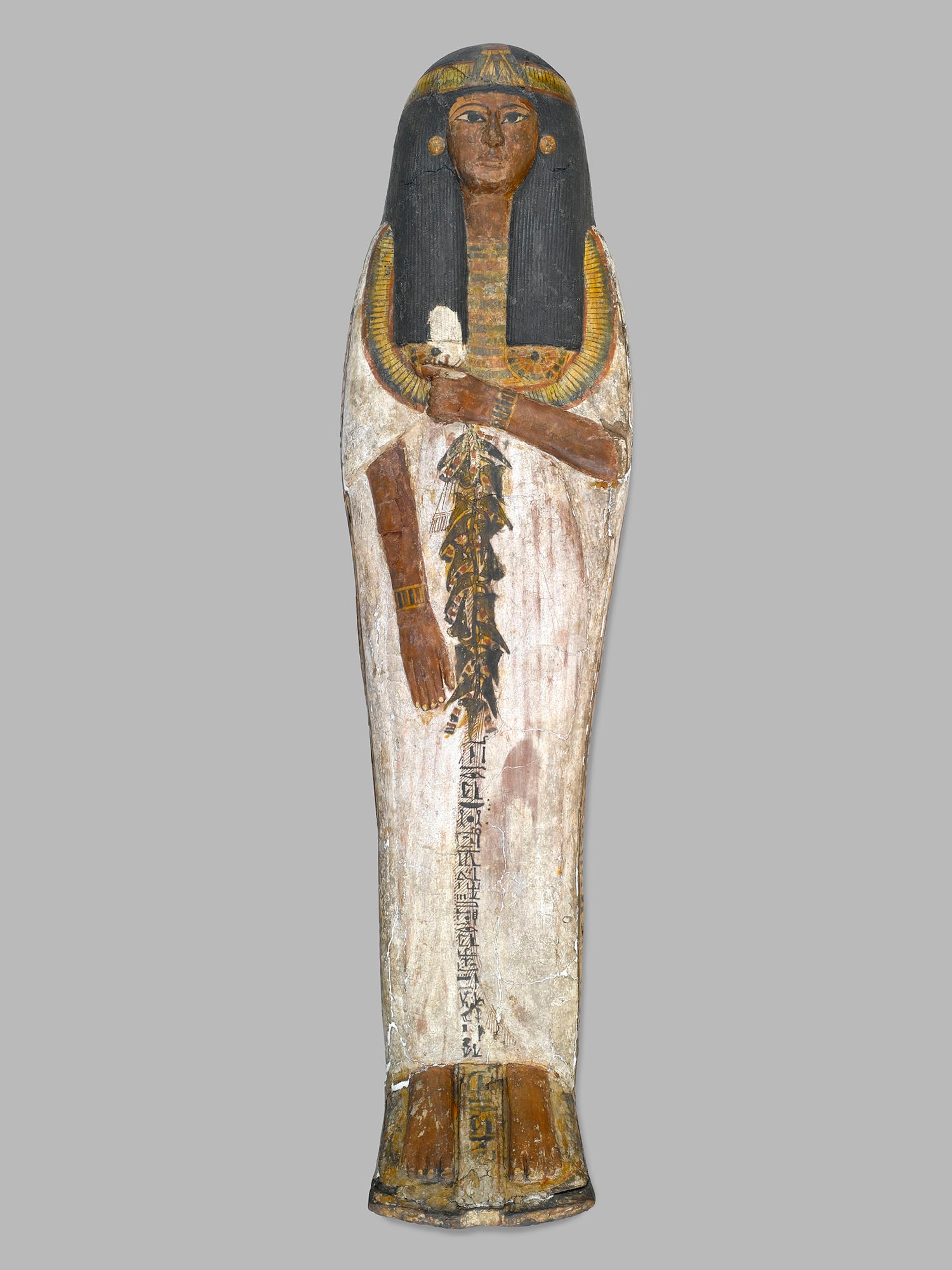 Coffin of the Lady of the House, Weretwahset, Reinscribed for Bensuipet Containing Face Mask and Openwork Body Covering, circa 1292–1190 B.C.E. Wood, painted (fragments a, b); Cartonnage, wood (fragment c; cartonnage (fragment d) , 37.47Ea–b Box with Lid in place: 253/8 x 193/4 x 761/8 in. (64.5 x 50 x 193.5 cm). Charles Edwin Wilbour Fund, 37.47Ea–d. (Photo: Sarah DeSantis, Brooklyn Museum)