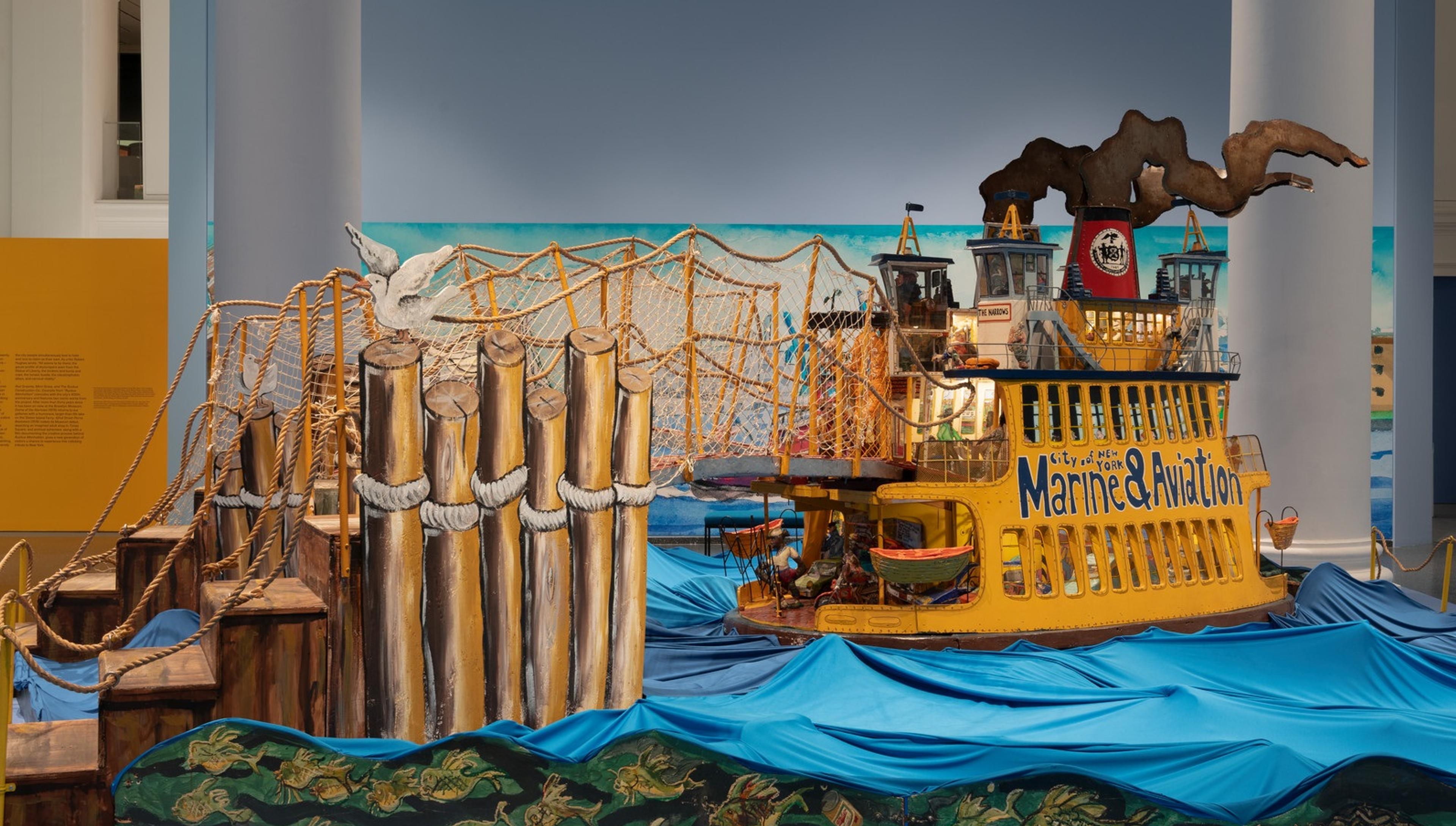 Installation view of <i>Red Grooms, Mimi Gross, and The Ruckus Construction Co.: Excerpts from “Ruckus Manhattan.”</i> Brooklyn Museum, June 13–November 2, 2025. © Red Grooms, Member of Artists Rights Society (ARS). © 2025 Mimi Gross / Artists Rights Society (ARS), New York. (Photo: Paula Abreu Pita)