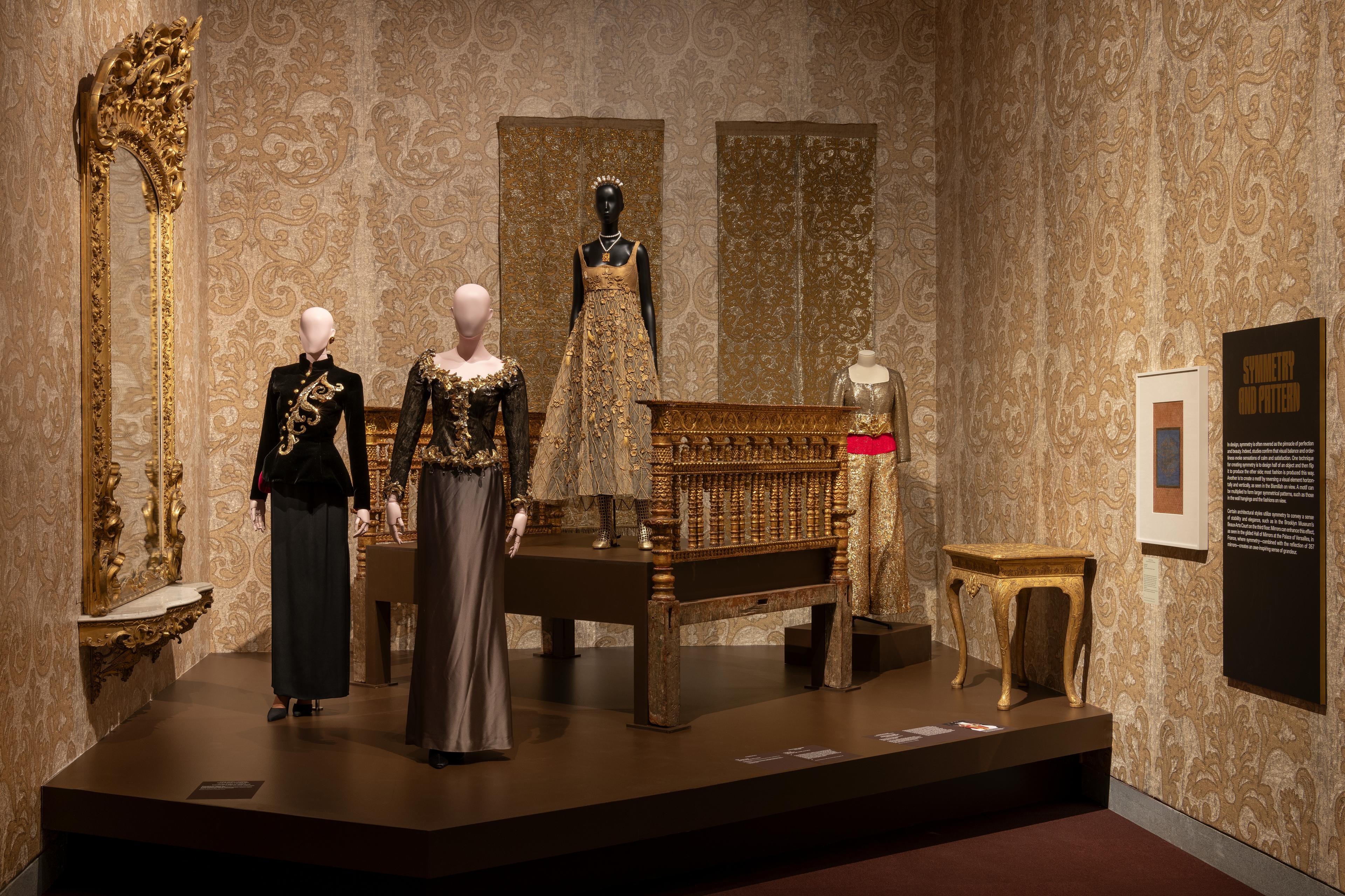 An installation of gold fashions in Solid Gold