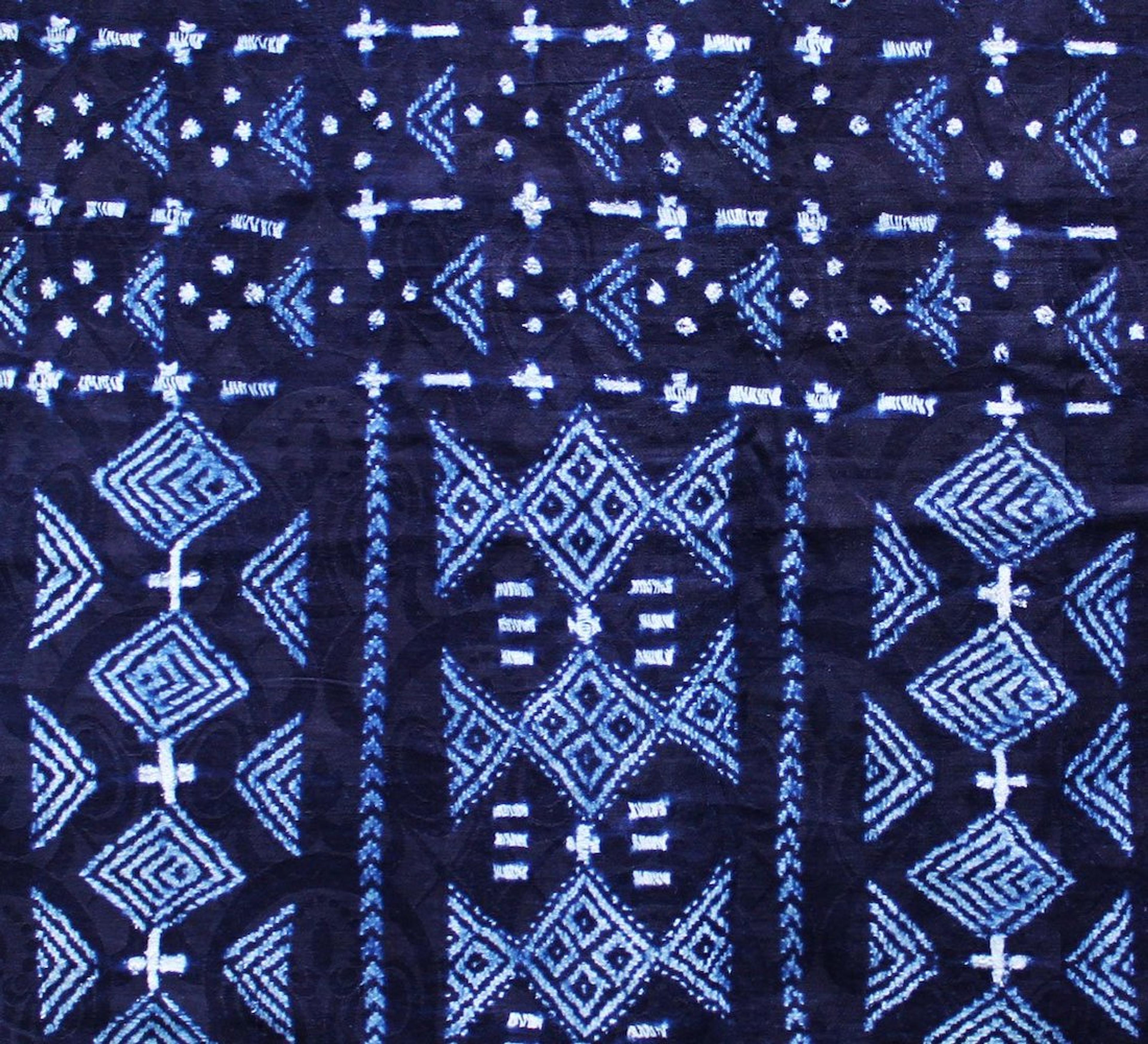 Detail of vintage Wolof prestige cloth date unknown; indigo dyed damask with a stitch resist, acquired by the author in St. Louis, Senegal. Photo courtesy of The McKinley Collection.