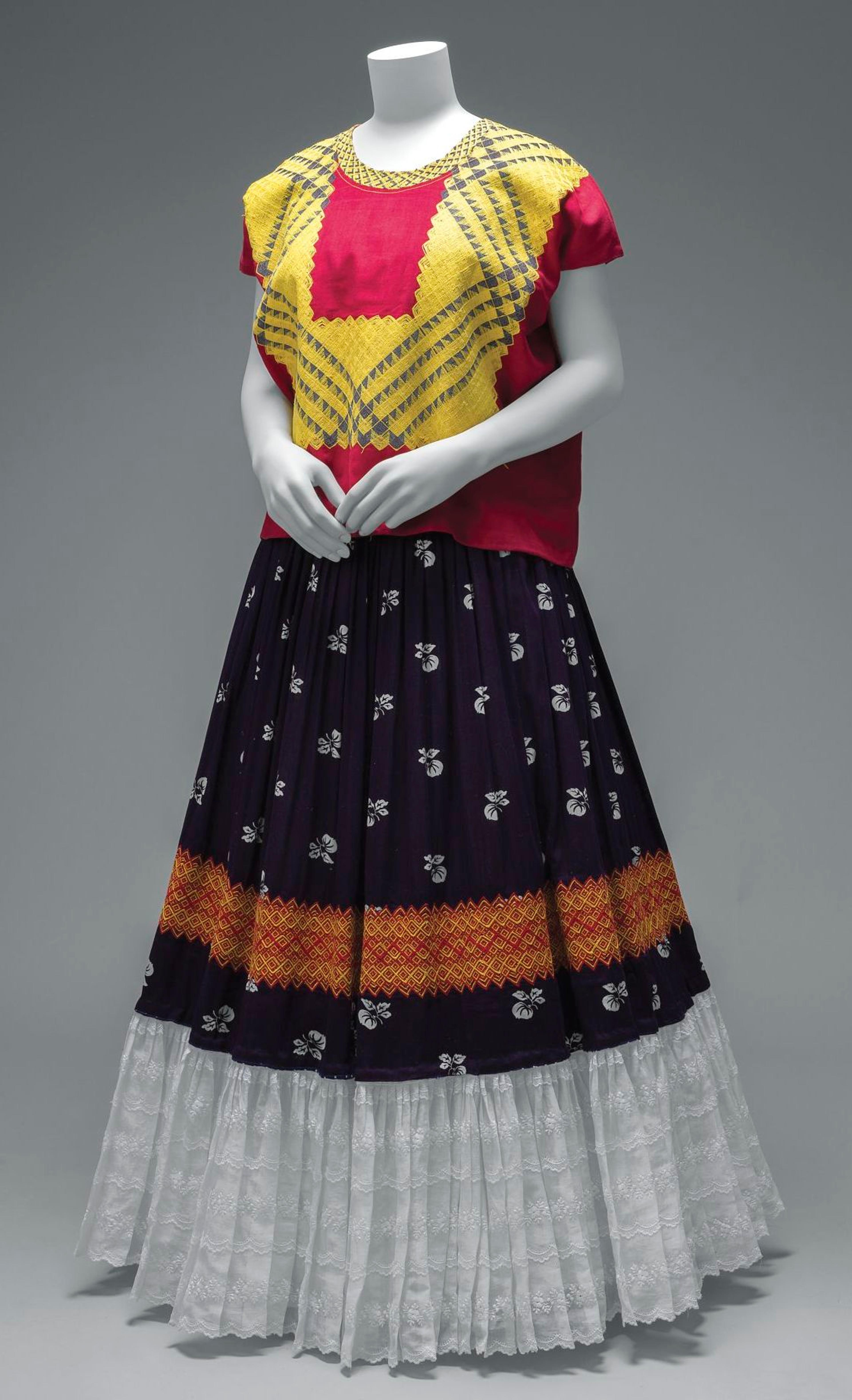 Cotton huipil with machine-embroidered chain stitch; printed cotton skirt with embroidery and holán (ruffle). © Diego Rivera and Frida Kahlo Archives, Banco de México, Fiduciary of the Trust of the Diego Rivera and Frida Kahlo Museums. (Photo: Javier Hinojosa, courtesy of V&amp;A Publishing)