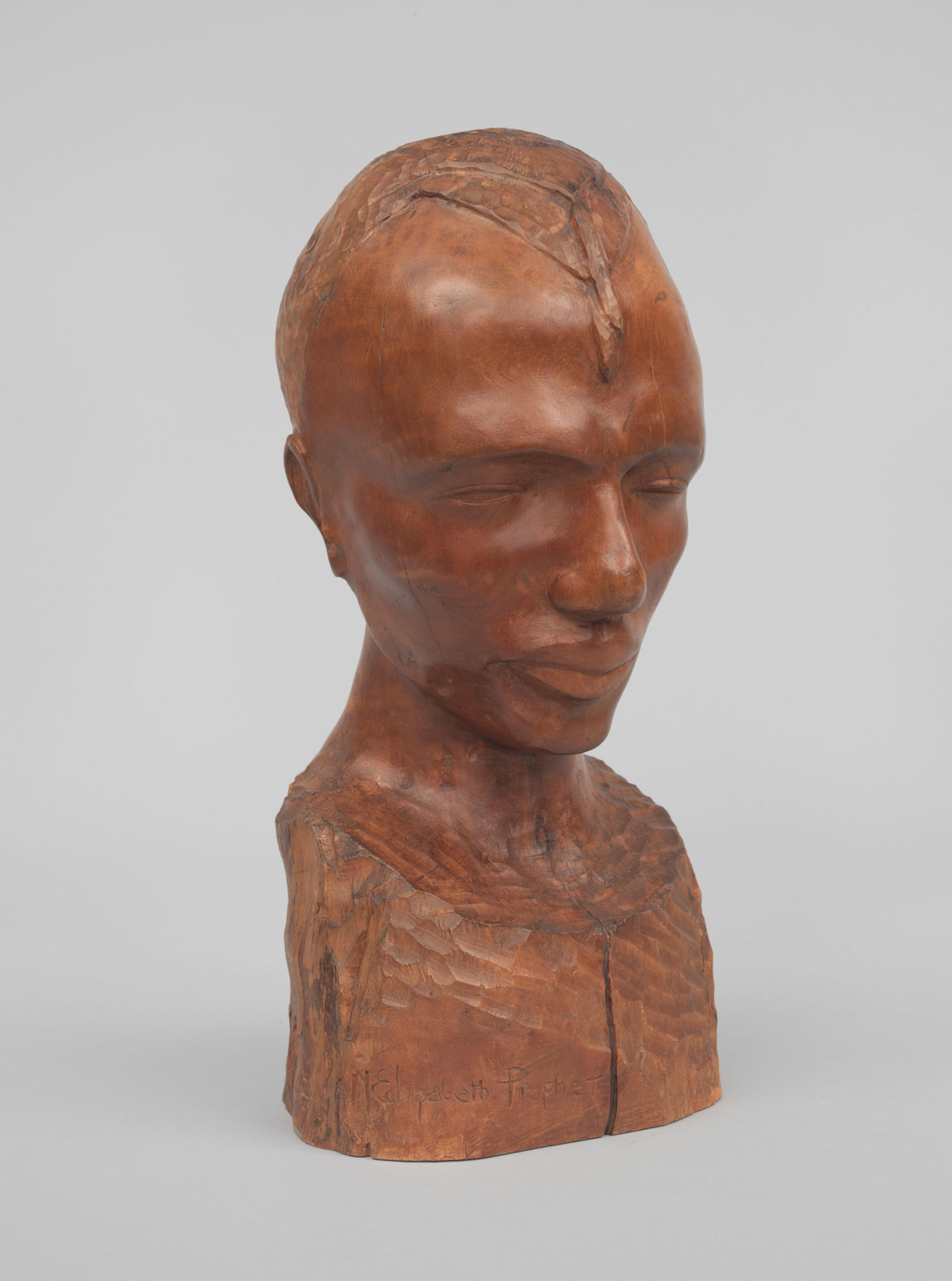 A wooden head sculpture