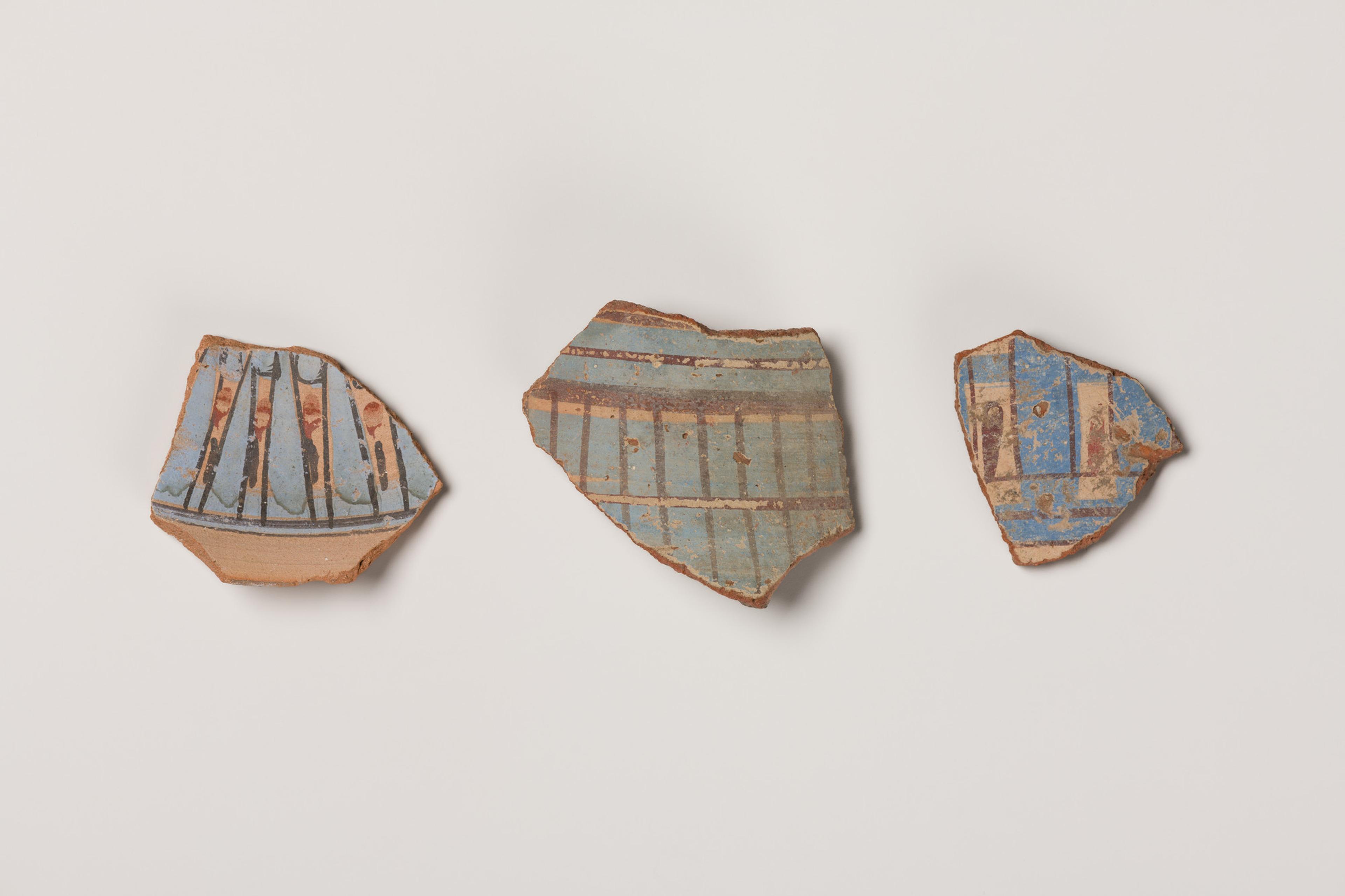 Three fragments of blue-painted ware possibly from Malkata (74.47.6, 74.47.4, 74.47.2), captured under visible light. They were part of three separate New Kingdom vessels. (Photo: Brooklyn Museum)