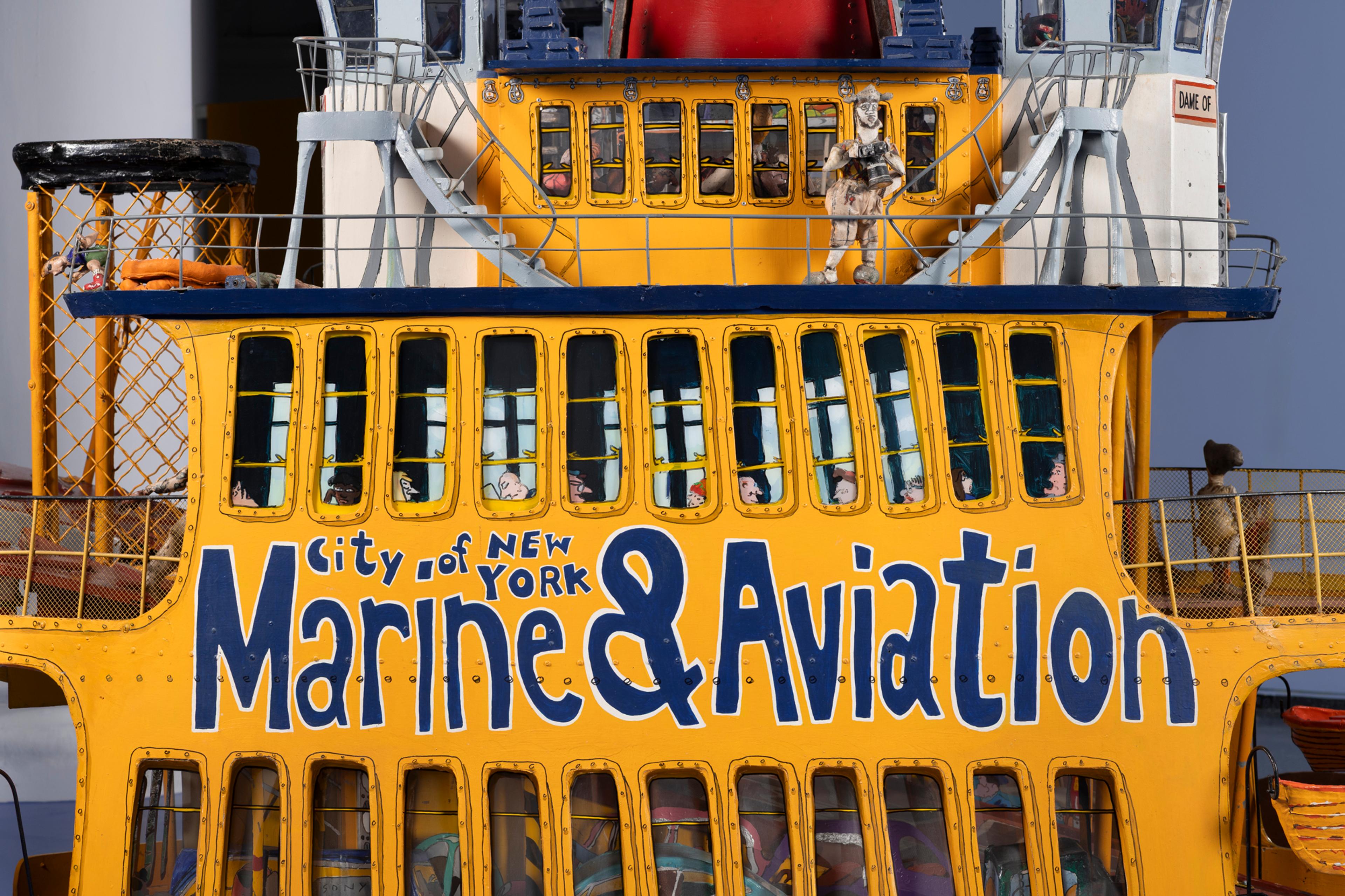 Yellow model ferry reading “City of New York Marine & Aviation”