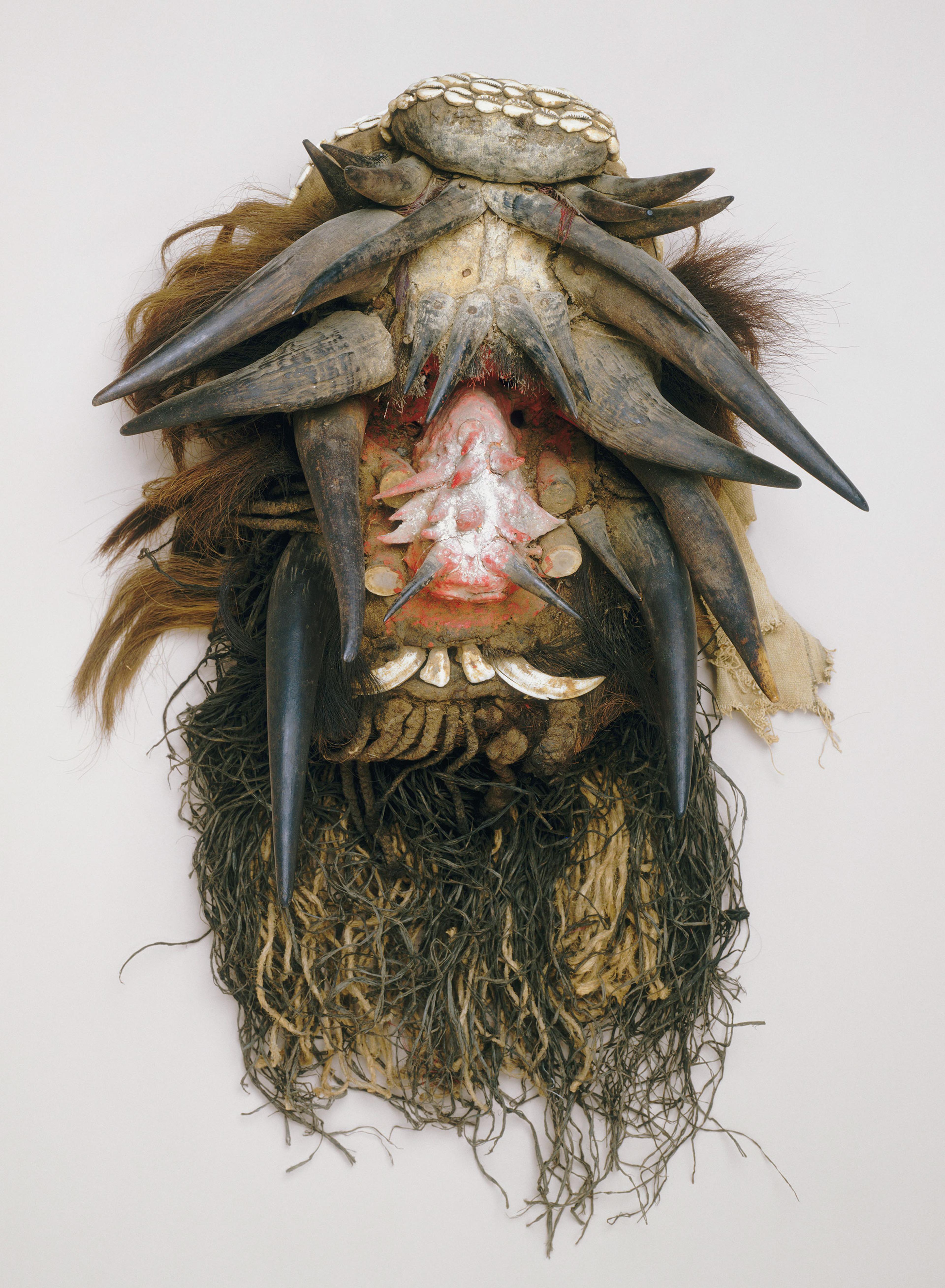 Unidentified We artist. Mask (Gela), Liberia or Côte d’Ivoire. Wood, raffia, cloth, teeth, horn, feathers, hair, fiber cord, cowrie shells, mud, and pigment, 317⁄8 x 18 x 11 in. (81 x 45.7 x 28.8 cm). Seattle Art Museum, Gift of Katherine White and the Boeing Company, 81.17.193