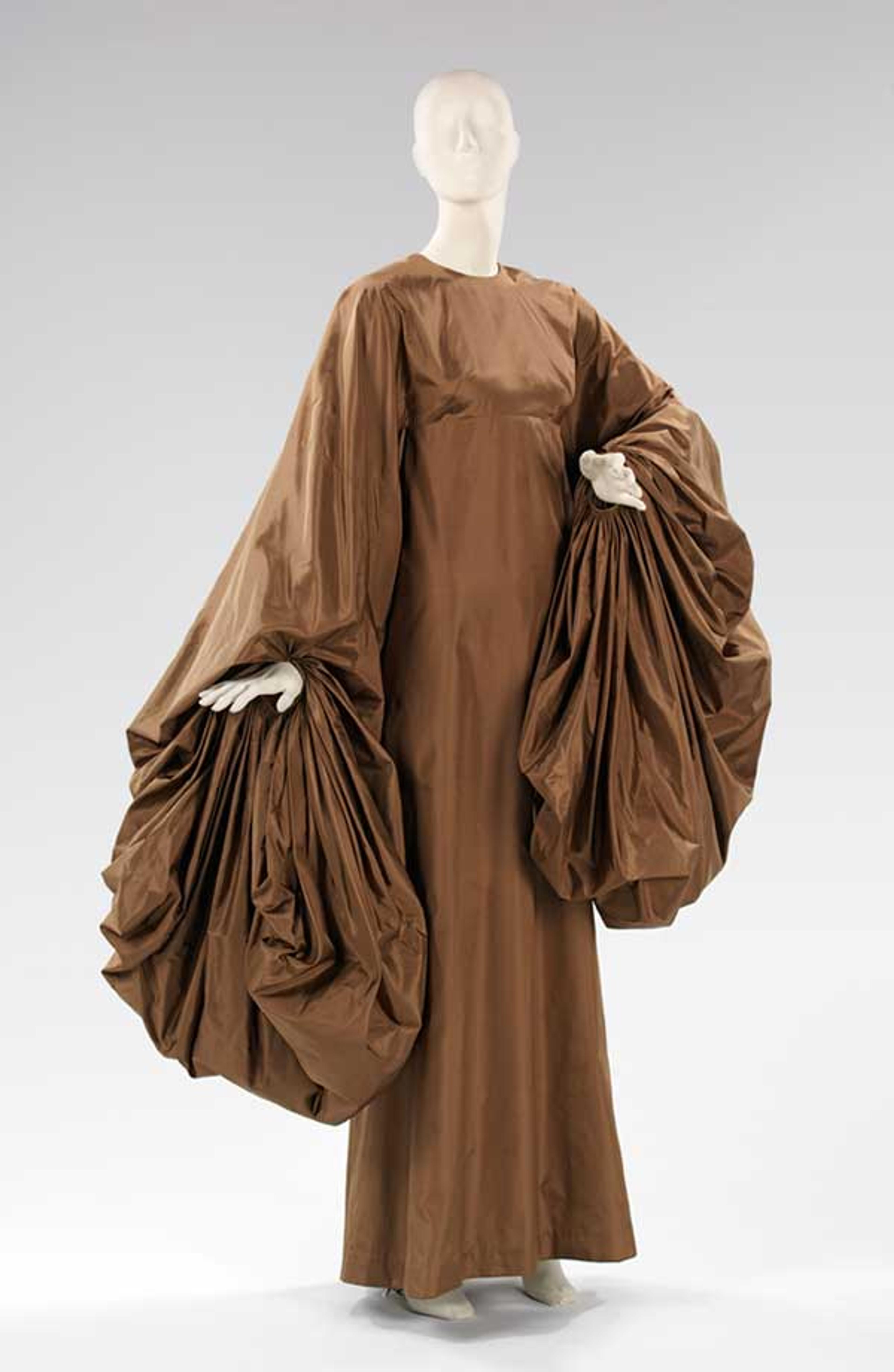 Madame Alix Grès (French, 1903–1993). Evening Dress, 1969. Taupe silk paper taffeta. Brooklyn Museum Costume Collection at The Metropolitan Museum of Art, Gift of the Brooklyn Museum, 2009; Gift of Mrs. William Randolph Hearst, Jr., 1988 (2009.300.1373)