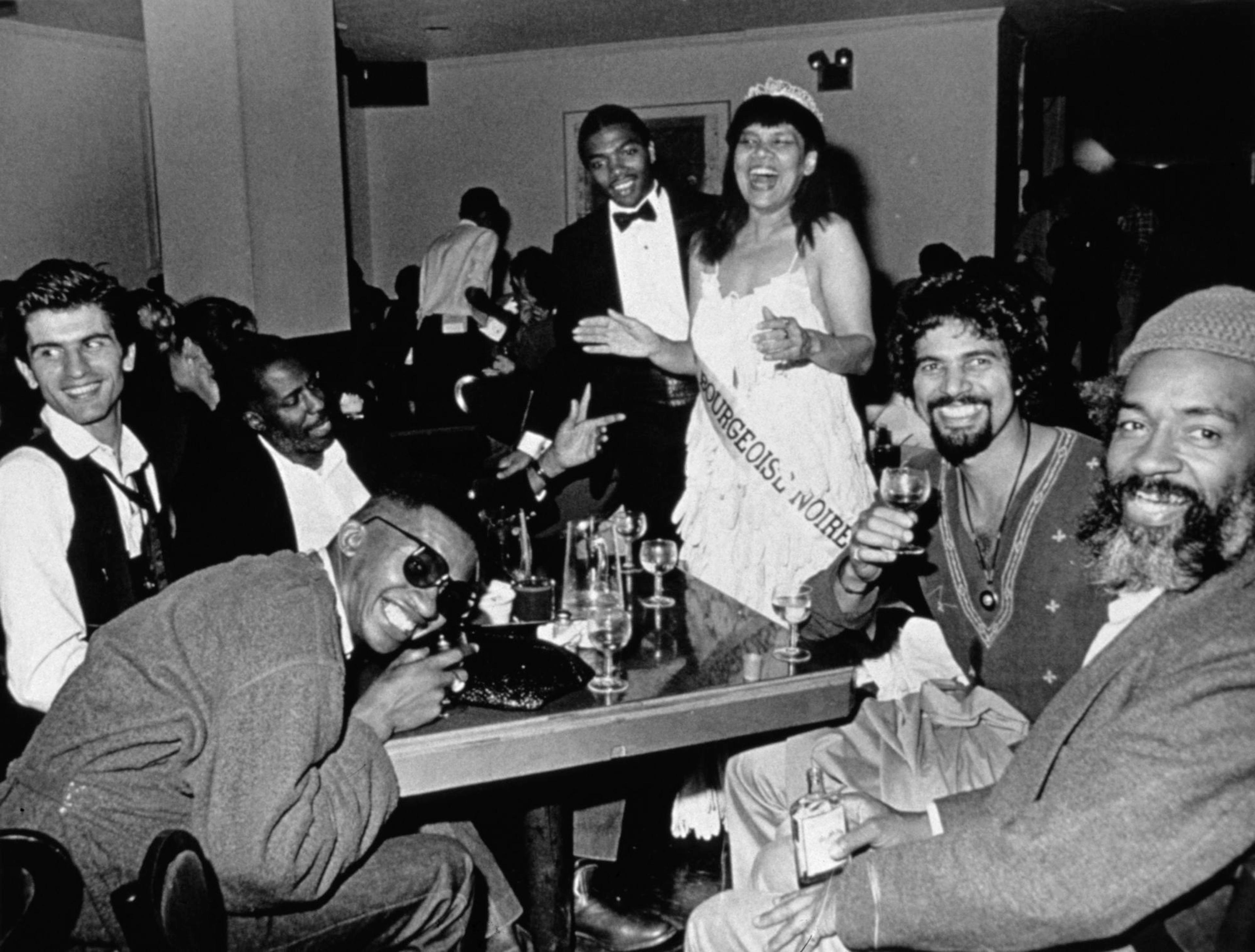 Lorraine O'Grady (American, born 1934). Mlle Bourgeoise Noire celebrates with her friends, from Mlle Bourgeoise Noire Goes to the New Museum, 1980–83/2009. Silver gelatin fiber photograph, 7 × 9.31 in. (17.78 × 23.65 cm). Edition of 8 plus 2 artist’s proofs. Courtesy of Alexander Gray Associates, New York. © Lorraine O’Grady/Artists Rights Society (ARS), New York