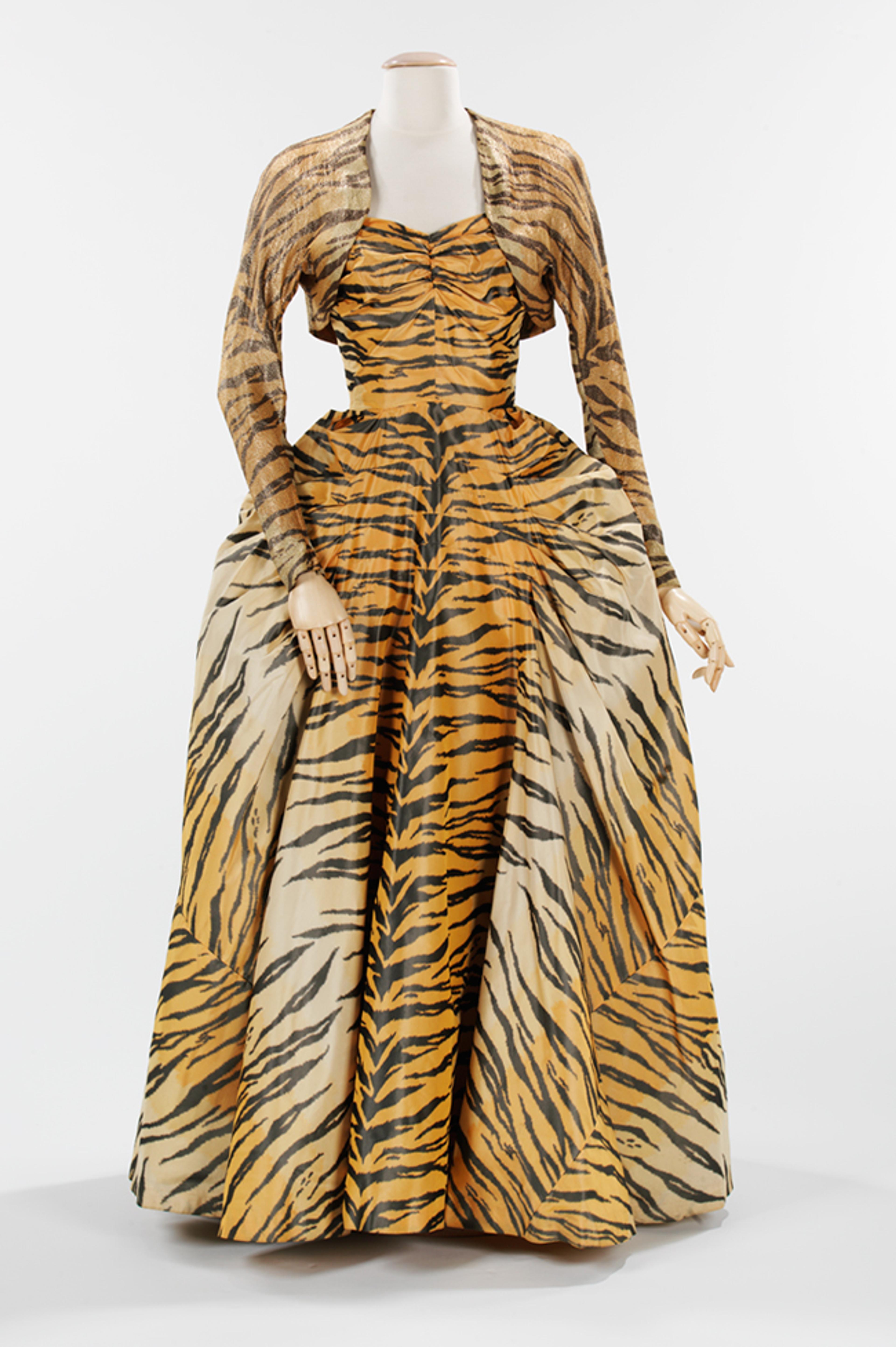 Gilbert Adrian (American, 1903–1959). “The Tigress” Evening Ensemble, 1949. Black, beige, and orange silk taffeta chiné; gold lamé. Brooklyn Museum Costume Collection at The Metropolitan Museum of Art, Gift of the Brooklyn Museum, 2009; Gift of Janet Gaynor Adrian, 1963 (2009.300.1297a, b)