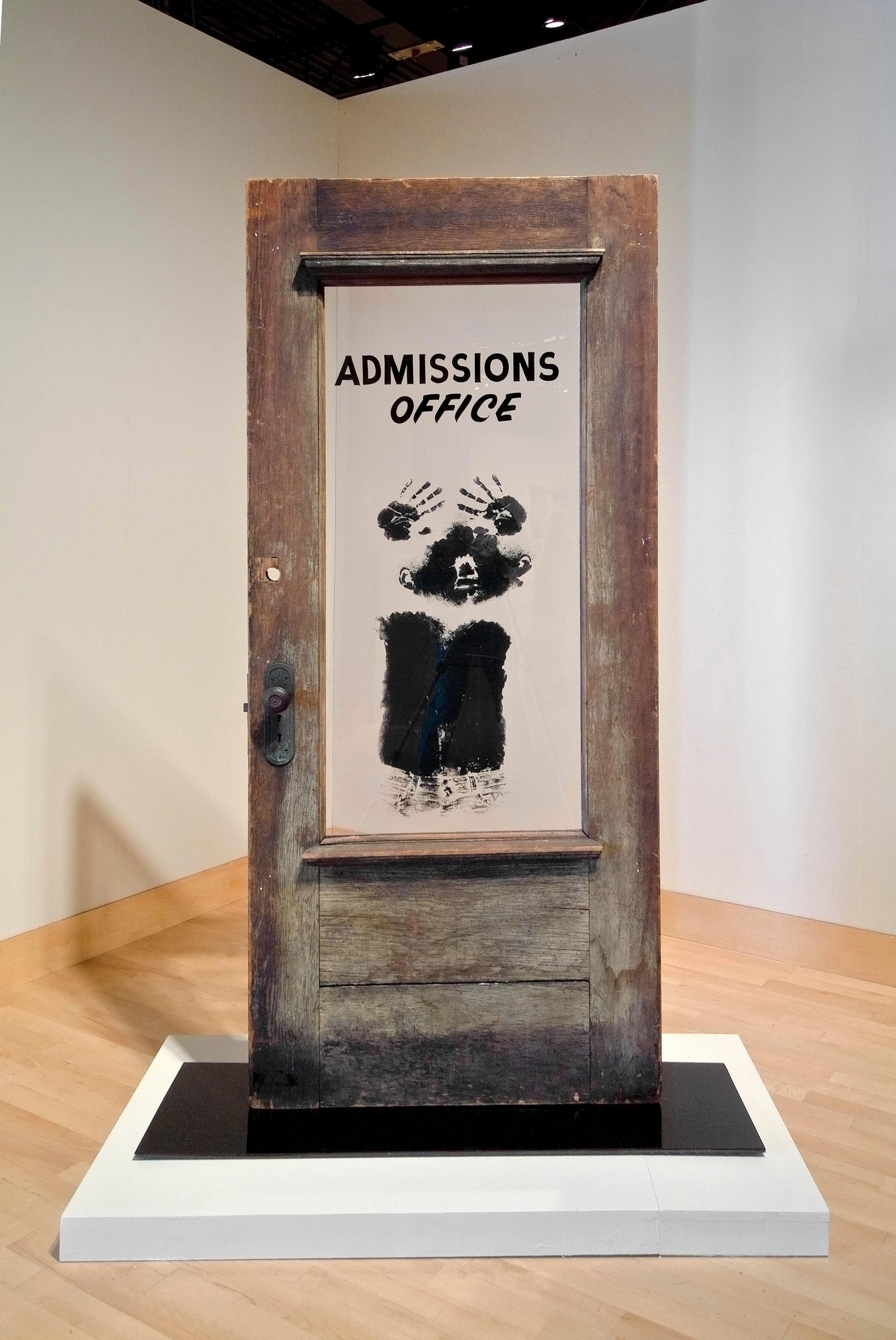 David Hammons (American, b. 1943). The Door (Admissions Office), 1969. Wood, acrylic sheet, and pigment construction, 79 × 48 × 15 in. (200.7 × 122 × 38.1 cm). California African American Museum, Los Angeles, Collection of Friends, the Foundation of the California African American Museum. © David Hammons