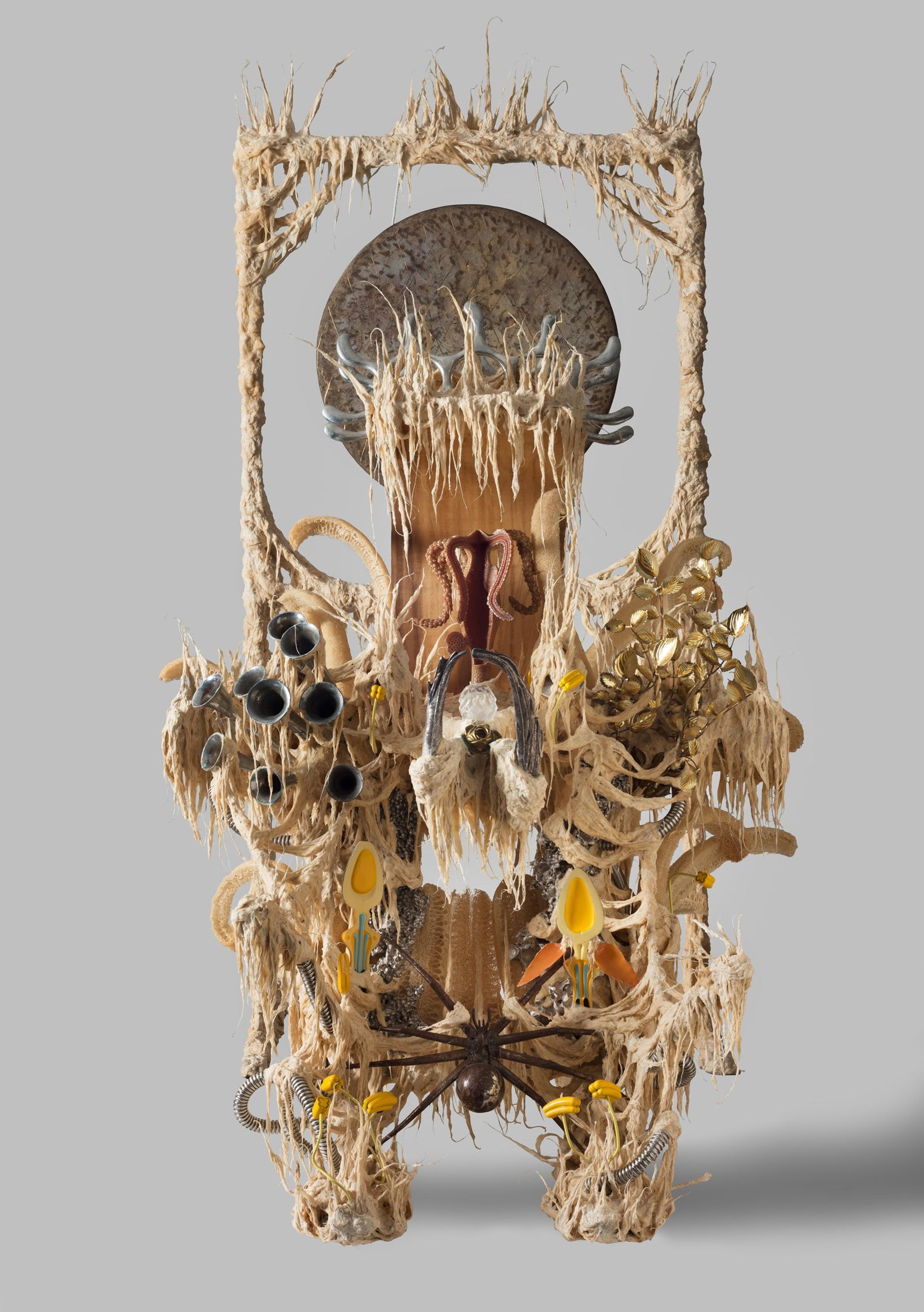 Guadalupe Maravilla (born El Salvador, 1976). Disease Thrower #18, 2021. Gong, steel, wood, cotton, glue mixture, plastic, loofah, objects collected from a ritual of retracing the artist's original migration route, 96 × 50 × 66 in. (243.8 × 127 × 167.6 cm). Brooklyn Museum, 2021.46. Courtesy of the artist and P·P·O·W, New York. © Guadalupe Maravilla. (Photo: Brooklyn Museum)