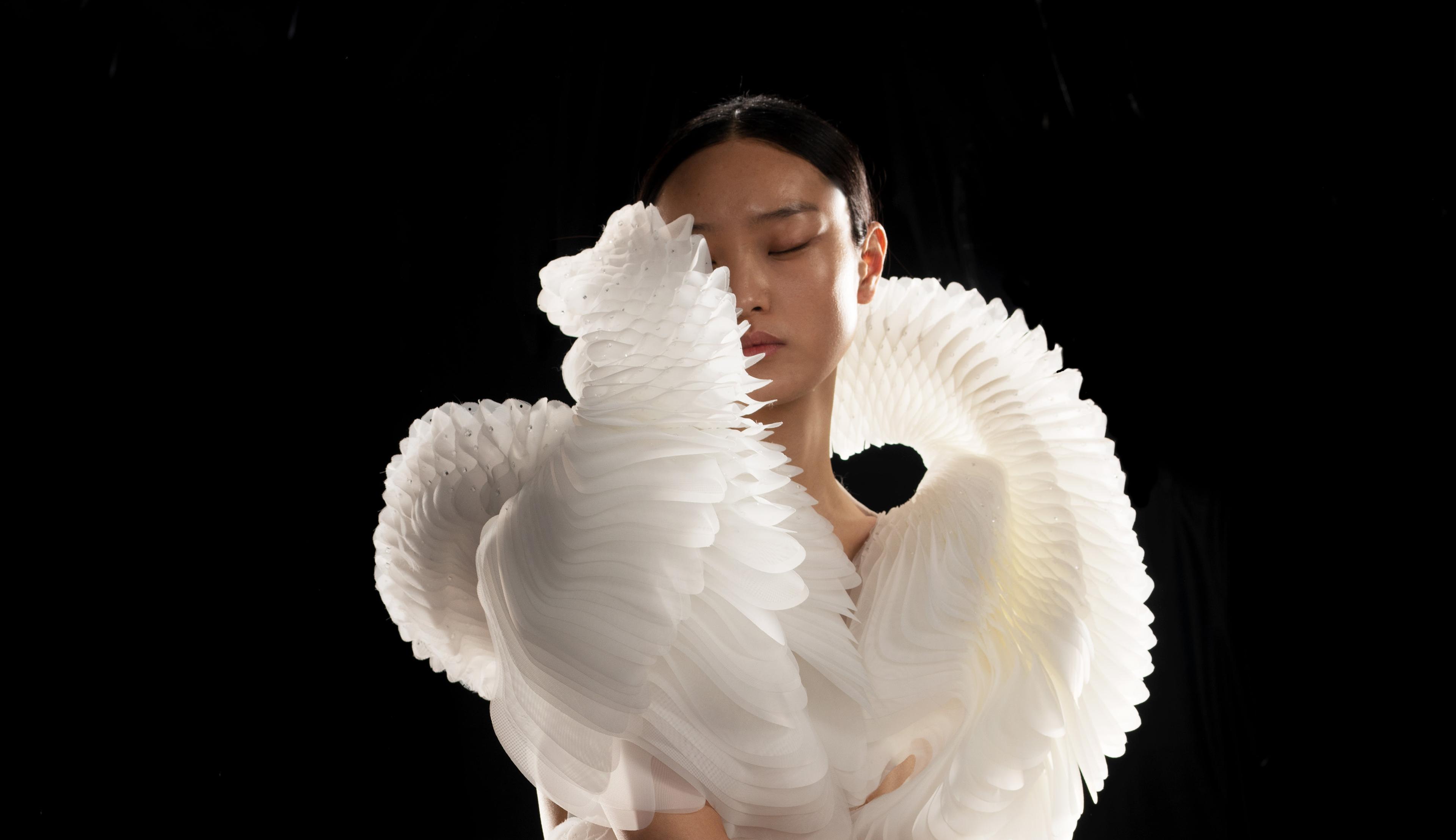 Iris van Herpen. <i>Morphogenesis</i> Dress, from the <i>Sensory Seas</i> collection, 2020. Laser-cut and screenprinted mesh, duchesse satin, and laser-cut Plexiglas. Collaborator: Philip Beesley. Model: Yue Han. (Photo: David Ụzọchukwu)