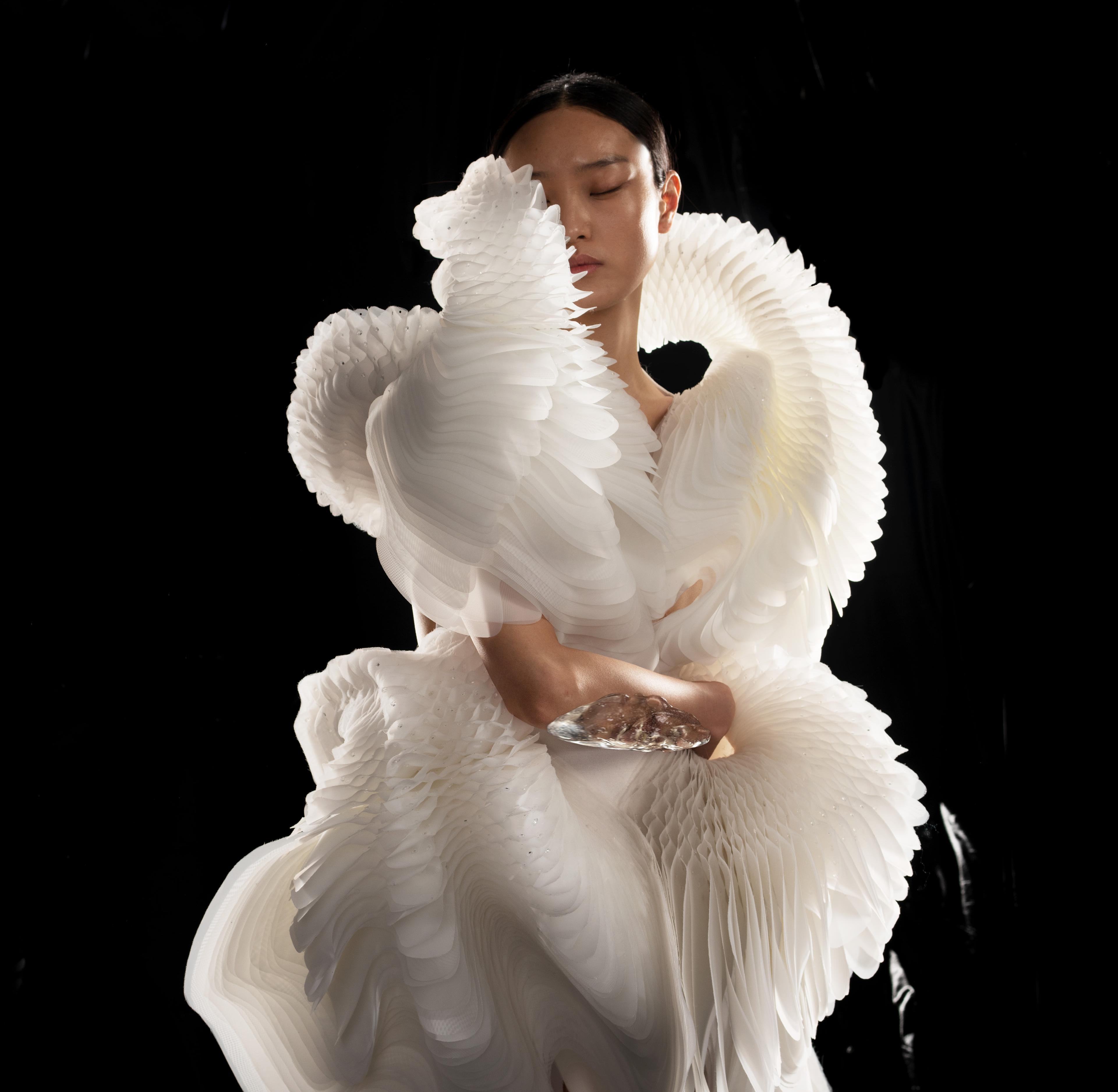 Iris van Herpen. <i>Morphogenesis</i> Dress, from the <i>Sensory Seas</i> collection, 2020. Laser-cut and screenprinted mesh, duchesse satin, and laser-cut Plexiglas. Collaborator: Philip Beesley. Model: Yue Han. (Photo: David Ụzọchukwu)