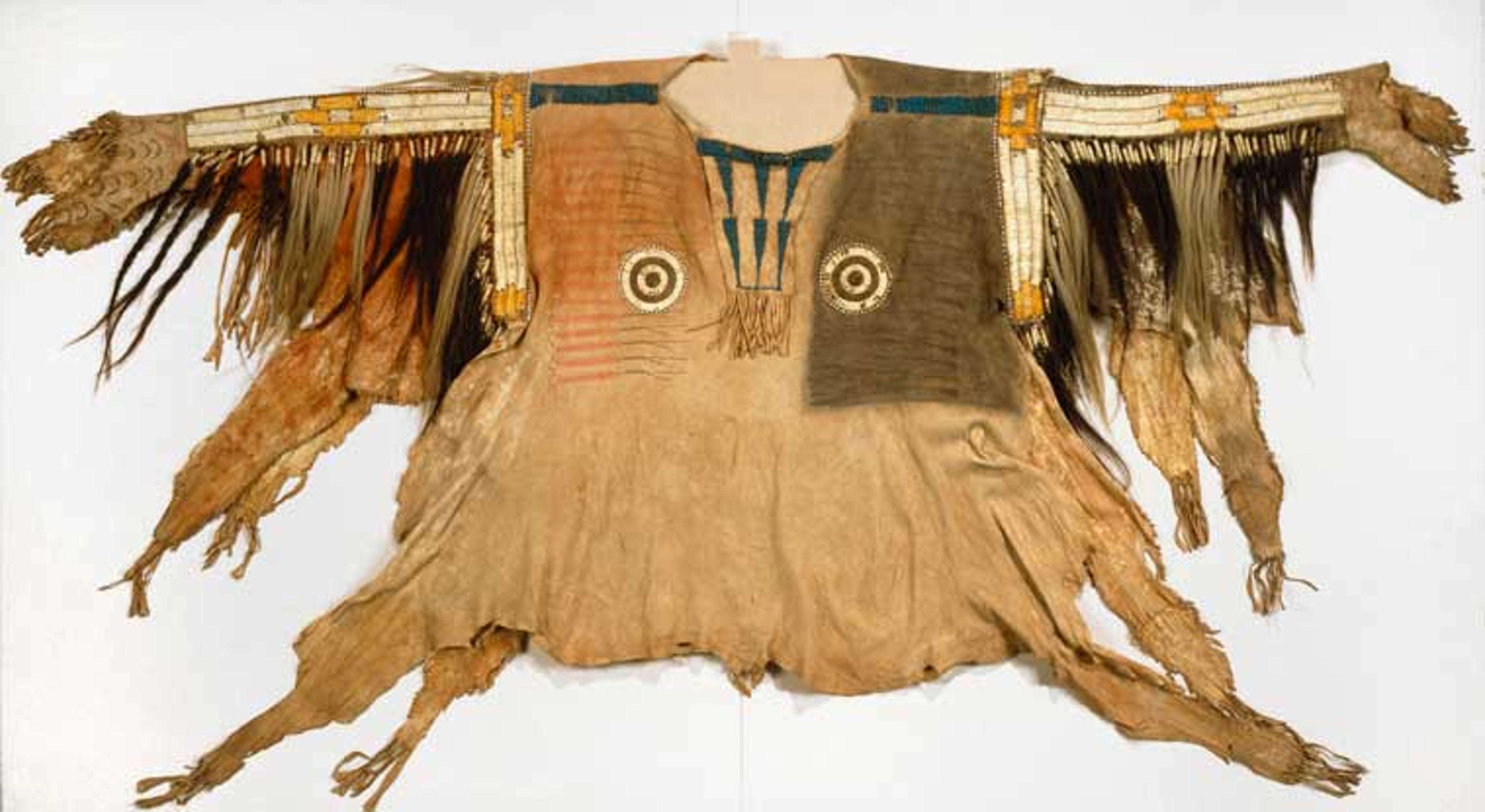 Yanktonai artist. Shirt for Chief’s War Dress, early 19th century. Fort Snelling, Minnesota. Buckskin, pony beads, porcupine quills, buckskin, maidenhair fern stems, human hair, horsehair, dye, feather, 44 × 68 in. (111.8 × 172.7 cm). Brooklyn Museum, Henry L. Batterman Fund and the Frank Sherman Benson Fund, 50.67.1a