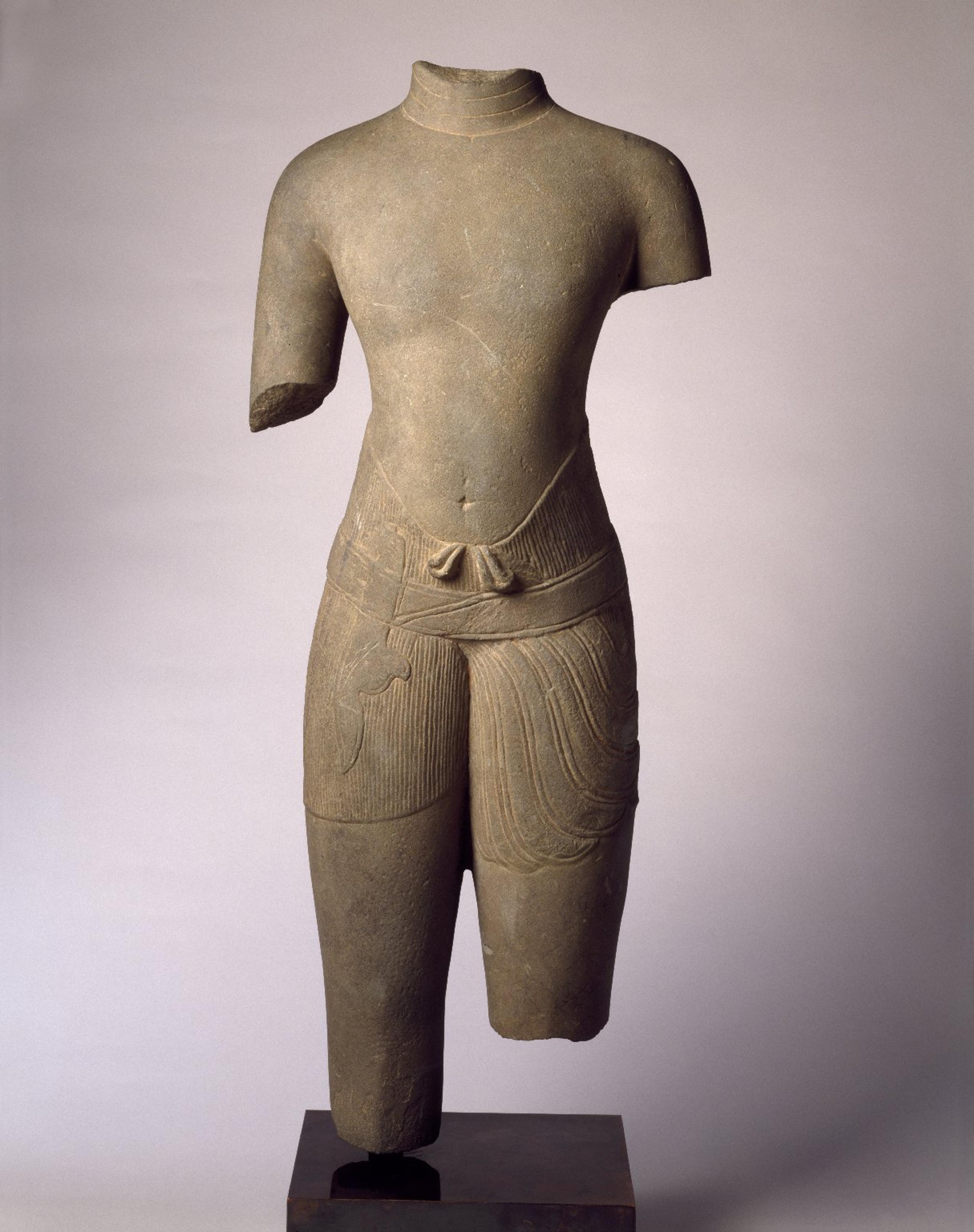 Torso of a Male Divinity, 1010–1080. Cambodia, Baphuon style. Sandstone, 301⁄2 x 121⁄4 x 53⁄4 in. (77.5 × 31.1 × 14.6 cm). Brooklyn Museum; Gift of Georgia and Michael de Havenon, 1996.210.1