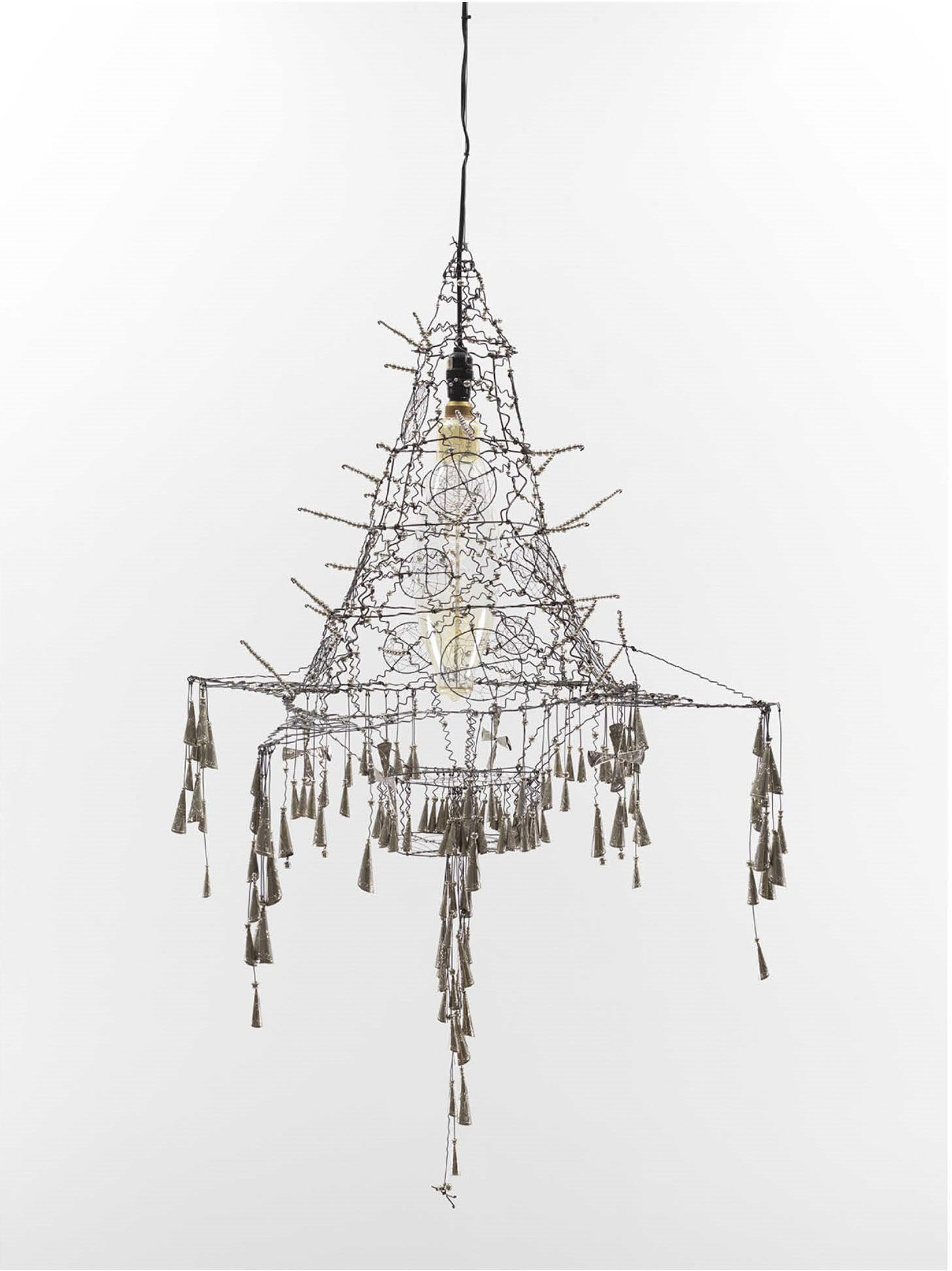 A wire chandelier adorned with dangling tassels