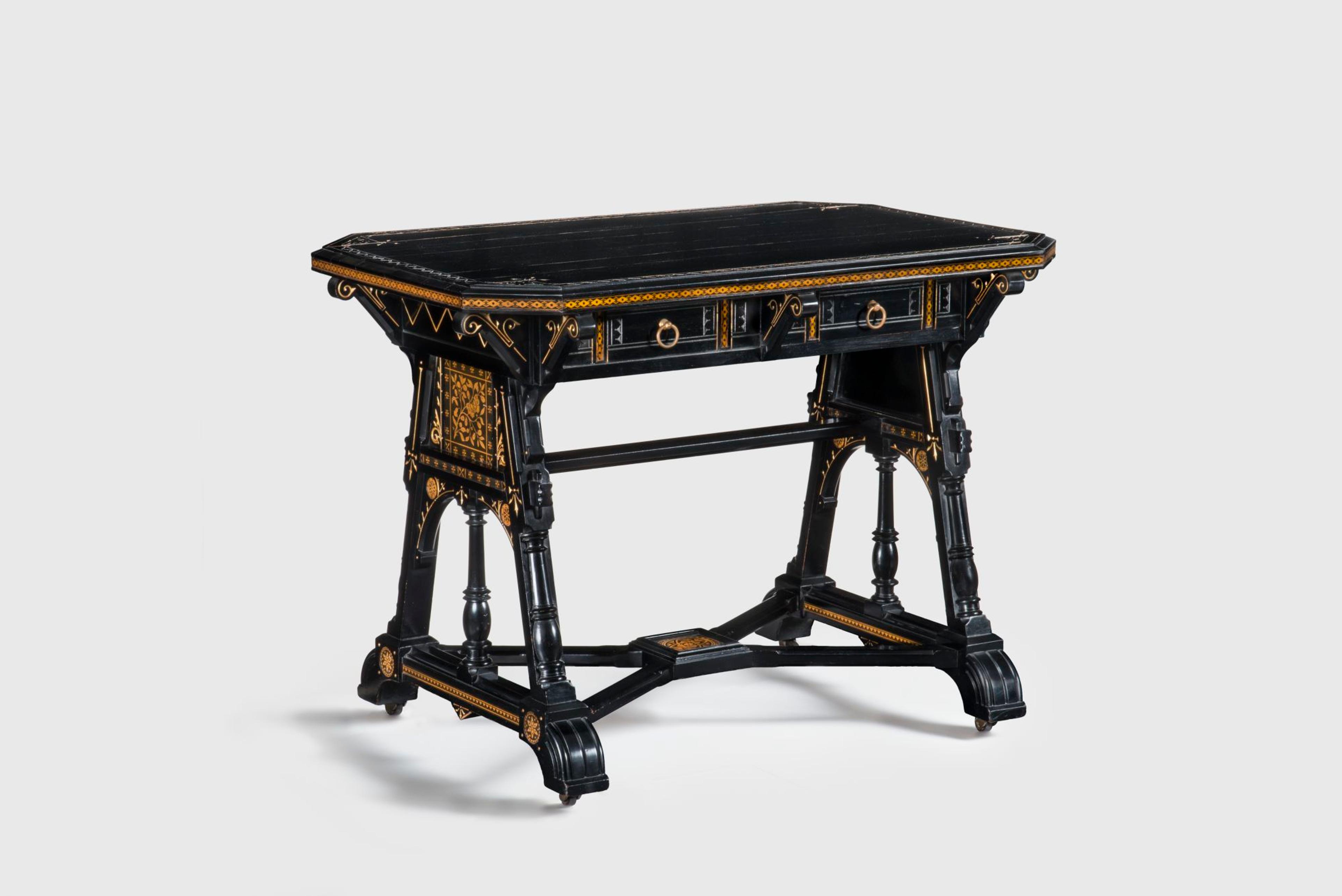 Kimbel and Cabus (New York, 1863–82). Table, circa 1875. Ebonized wood, gilding, paper, metal. 307/8 × 42 × 27 in. (78.4 × 106.7 × 68.6 cm). Collection of Deedee and Barrie Wigmore. (Photo: Gavin Ashworth)