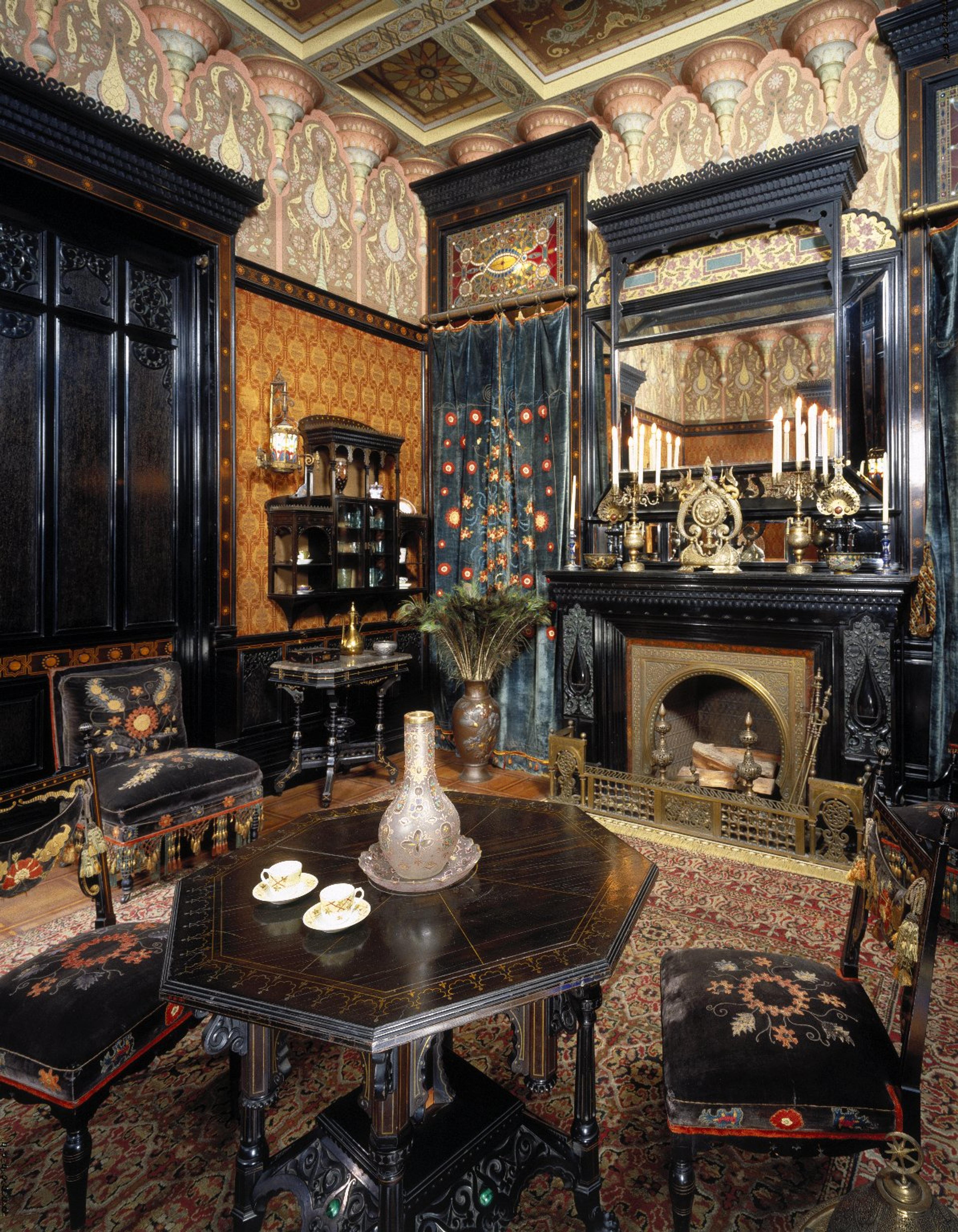 An opulent Victorian-style interior with intricate dark wood furniture, rich textiles, ornate wallpaper, and a fireplace