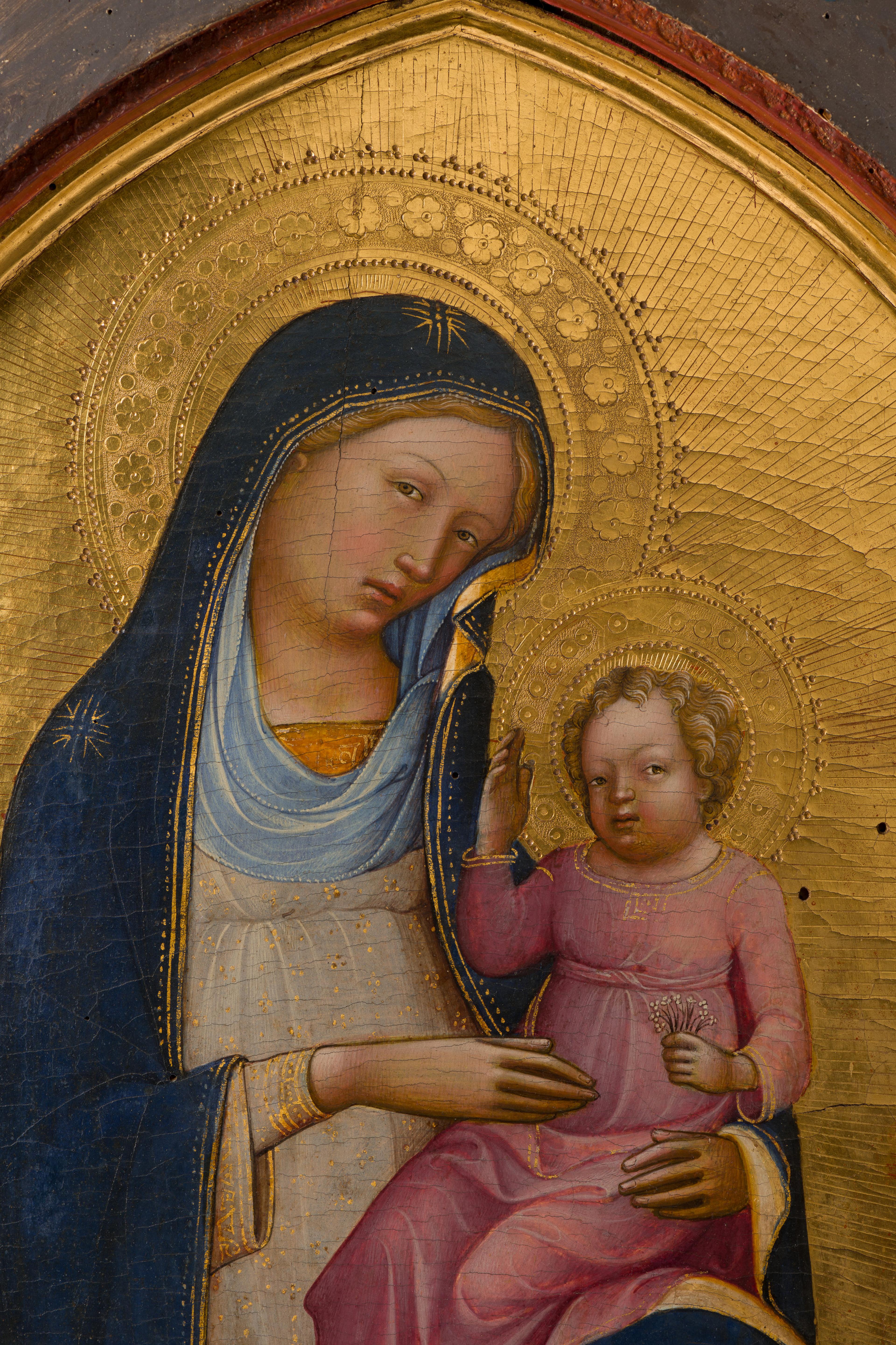 Seated parent and child figures set against a gold background