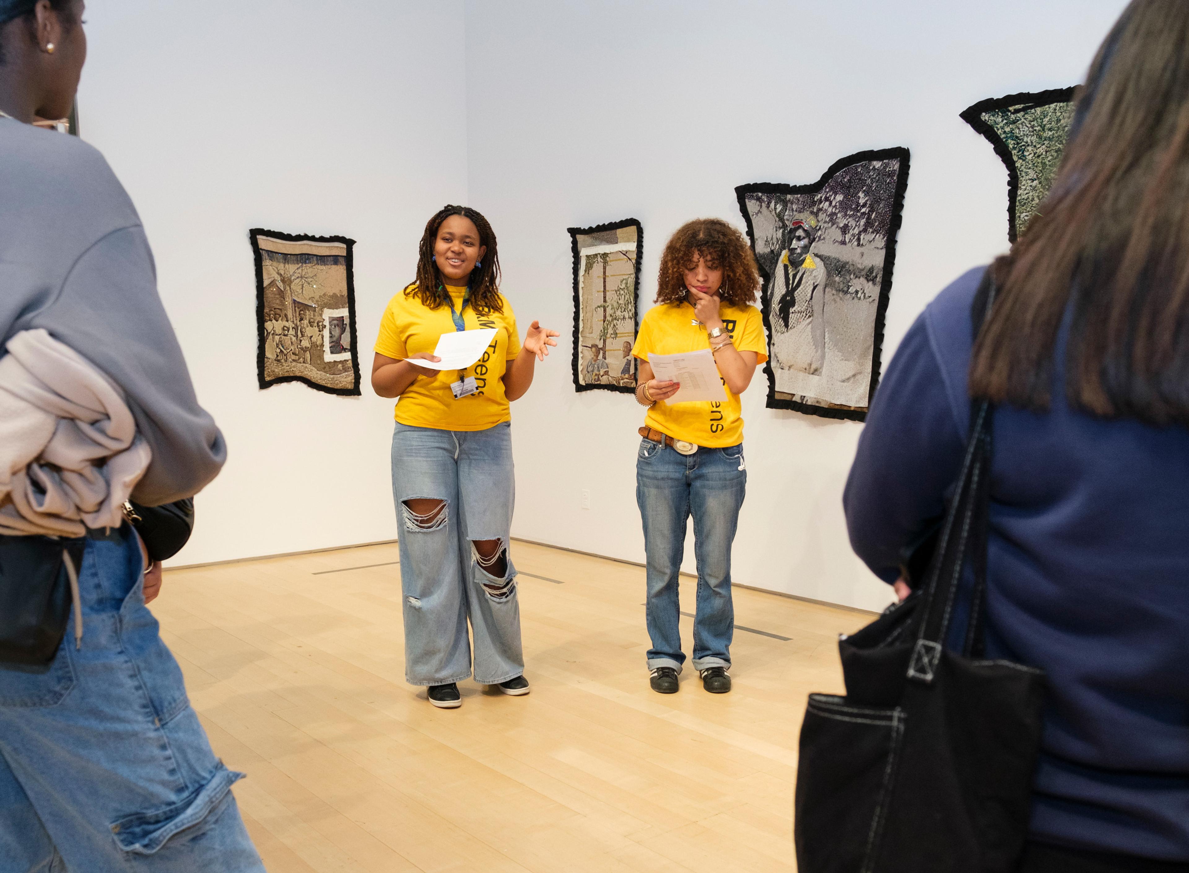 Teens reading in a gallery