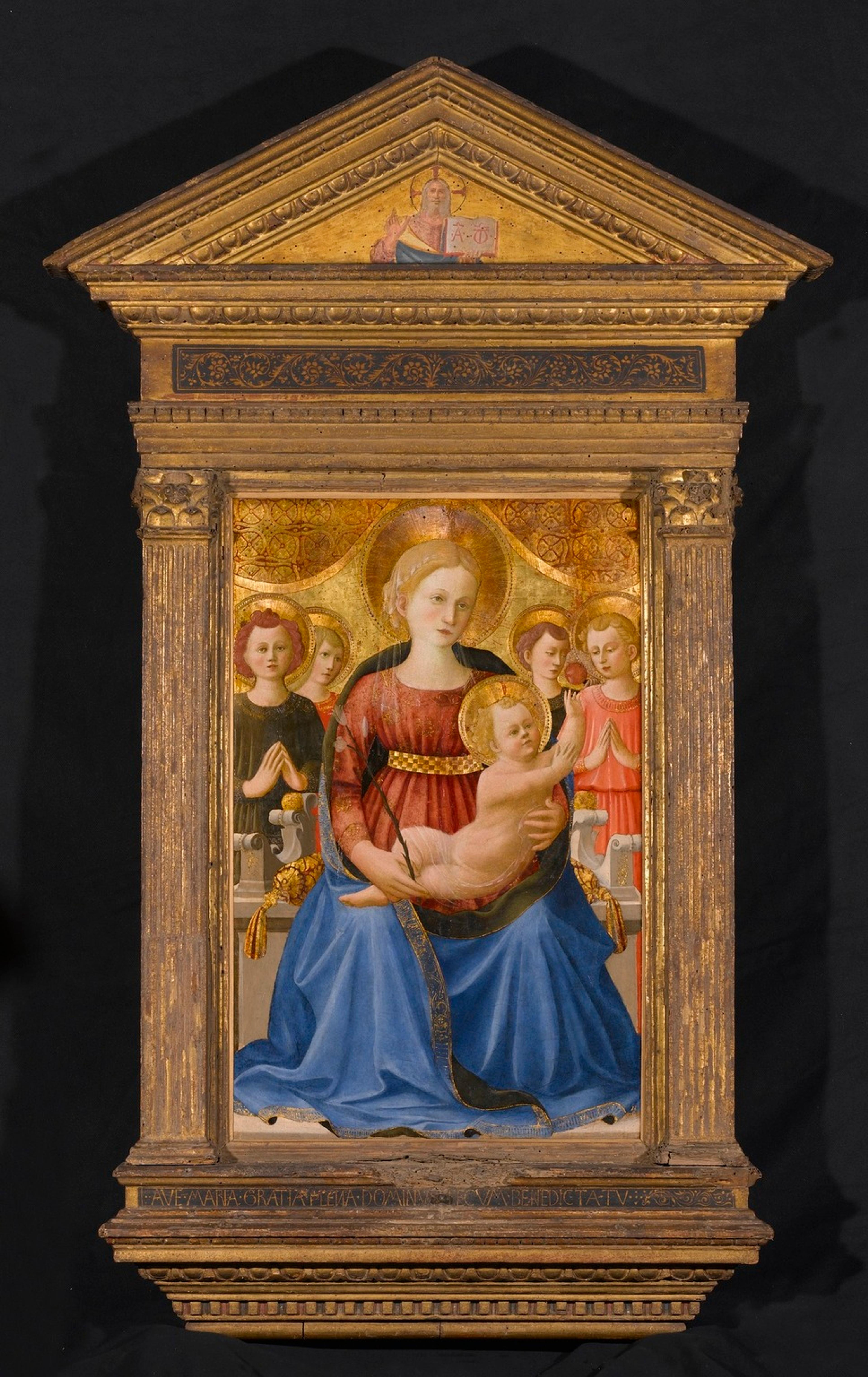 Painting of the Virgin and Child in a gilded frame topped with a pediment