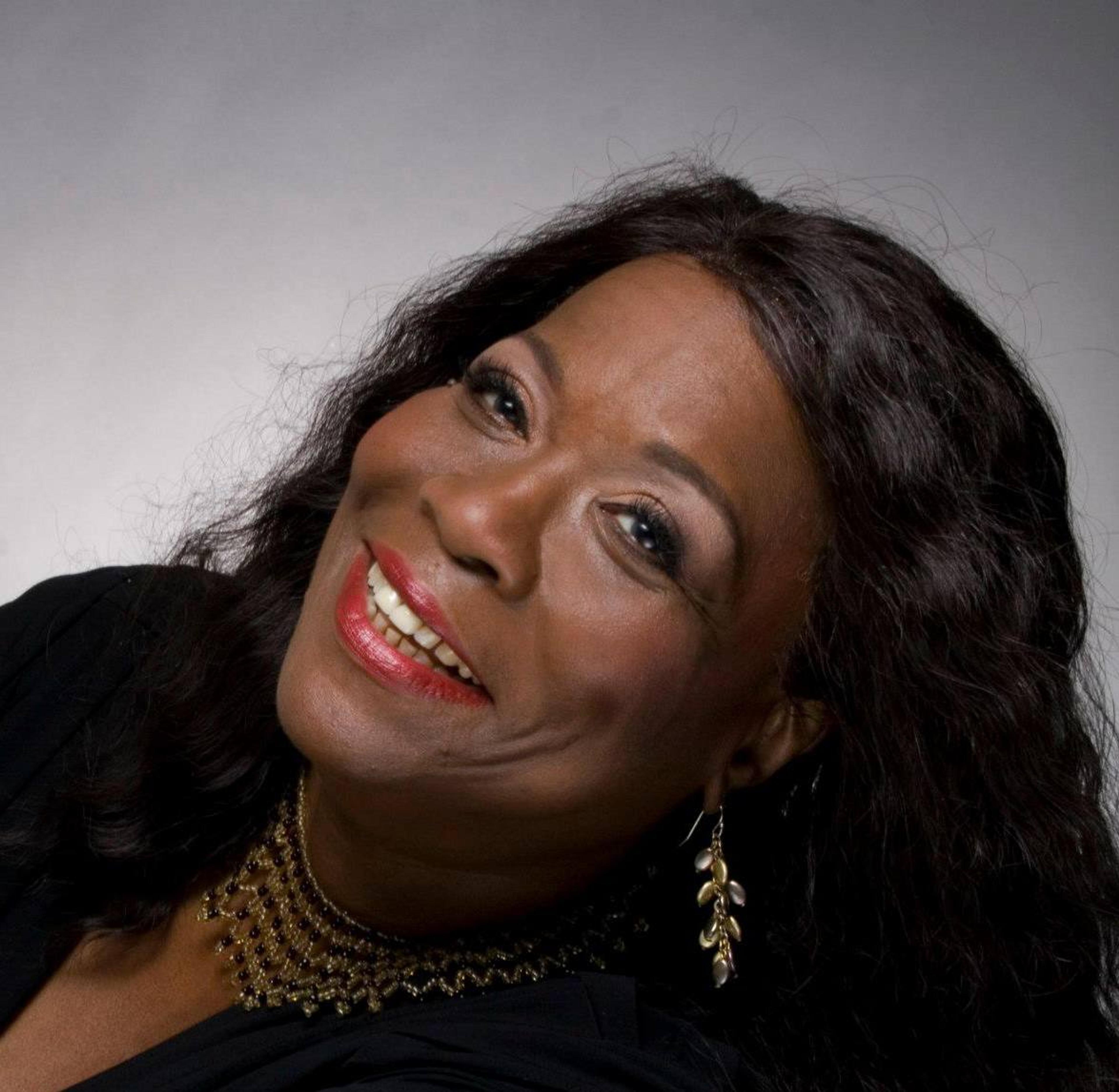 Ghanniyya Green smiles while posing for a headshot
